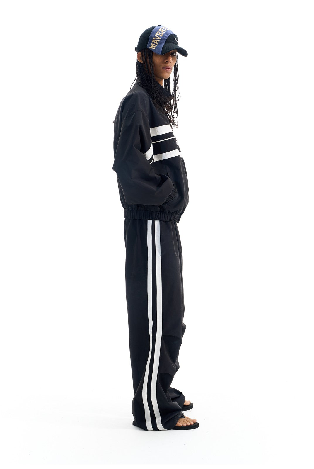 BLINDNOPLAN Striped Pleated Track Pants in Black - On Male Model