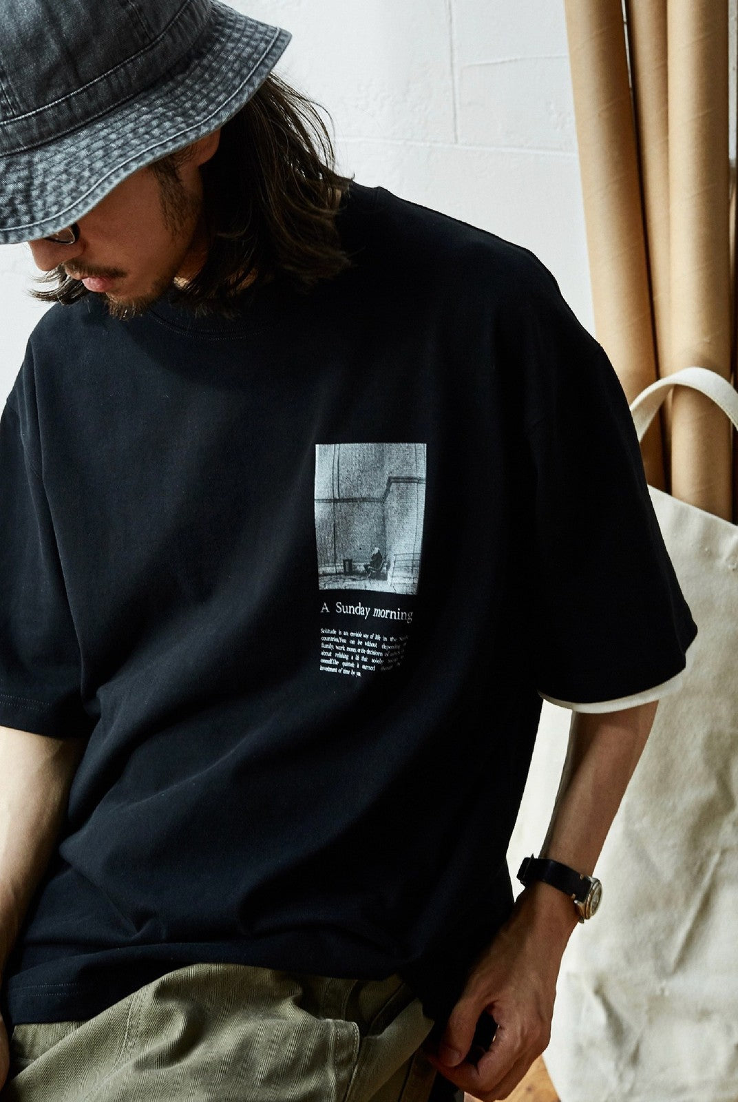 USAGE Air Spun Cotton Graphic T Shirt in Black - On Male Model