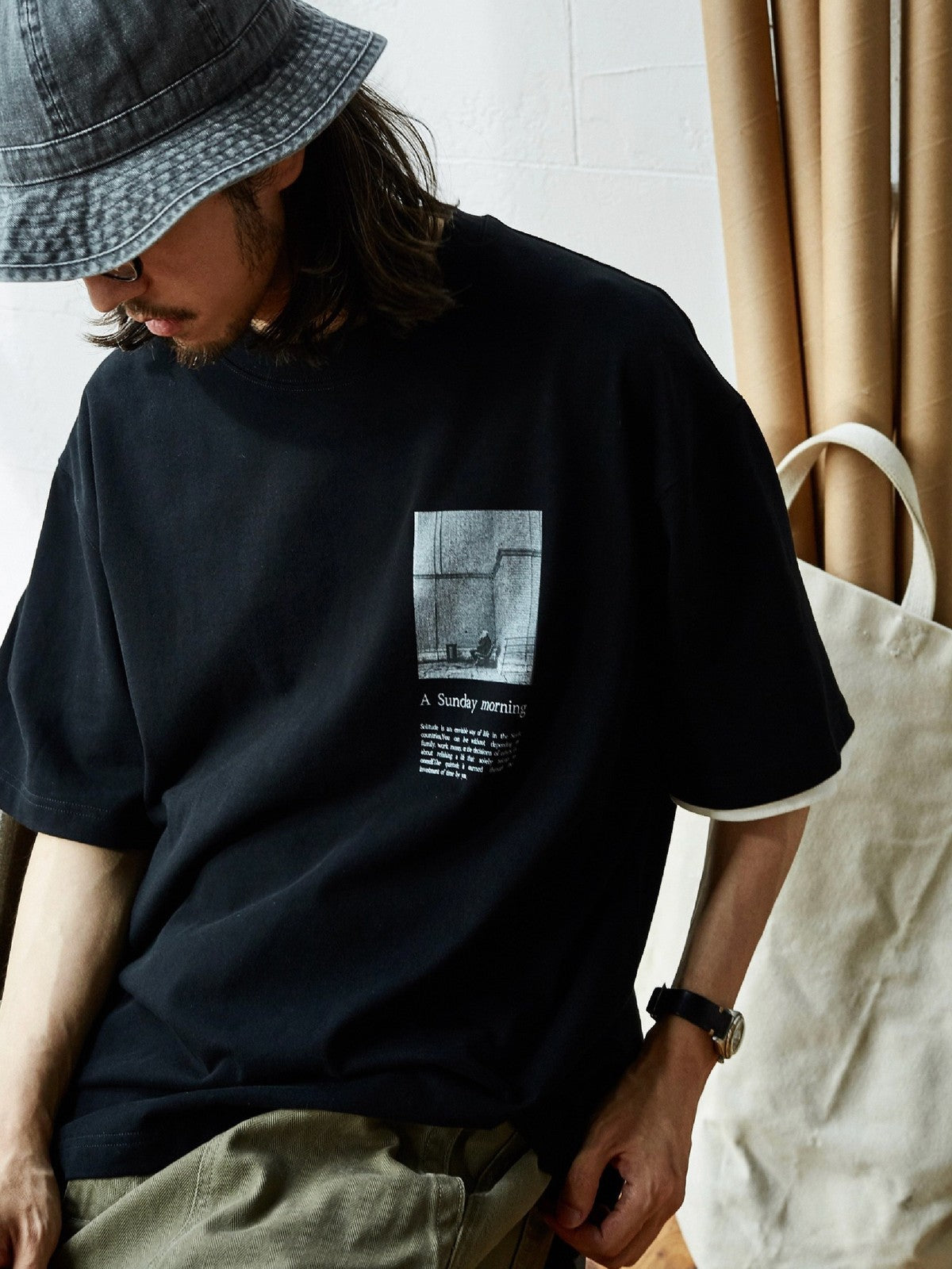 USAGE Air Spun Cotton Graphic T Shirt in Black - On Male Model