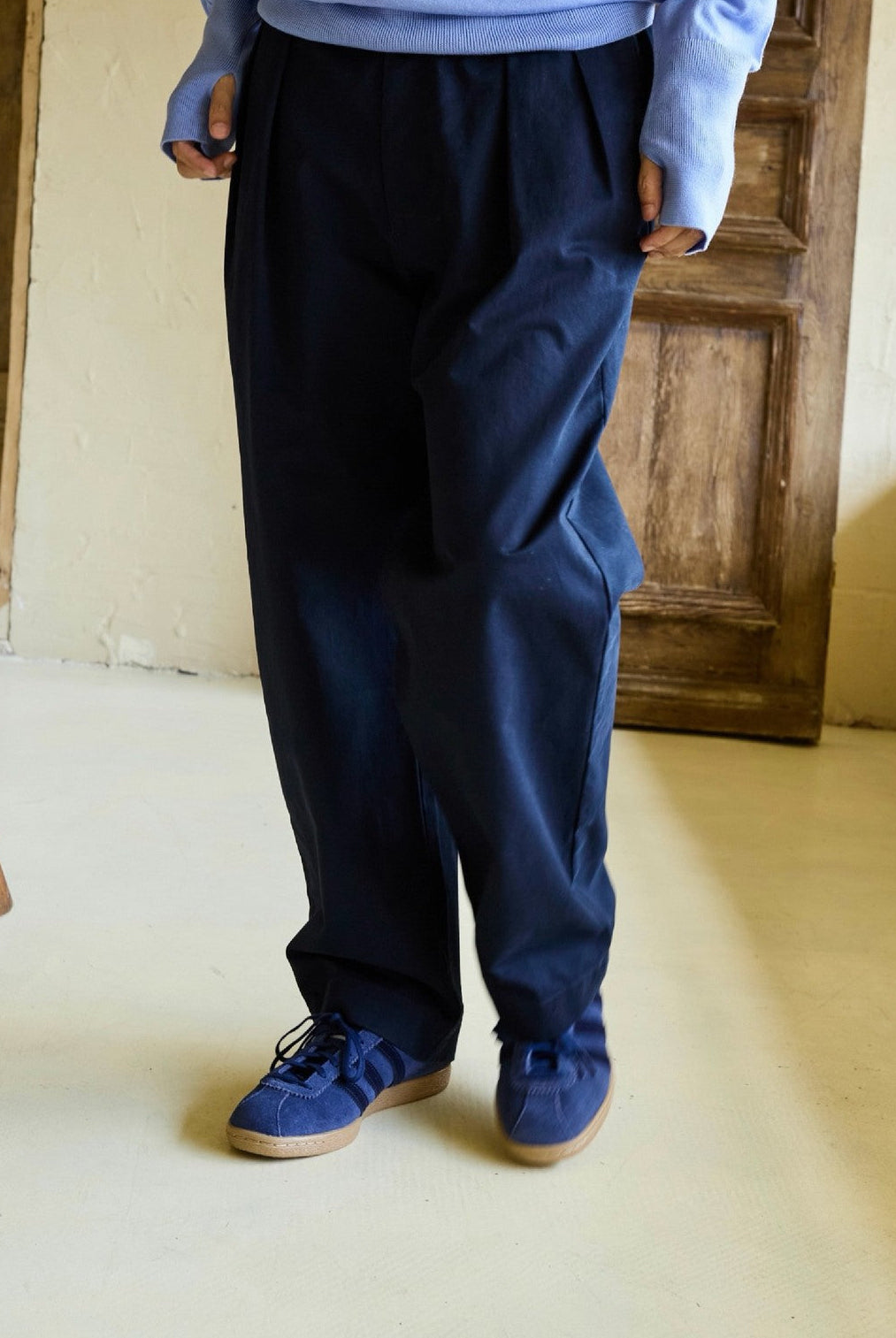 USAGE Pleated Cotton Twill Chinos in Navy Blue - On Model