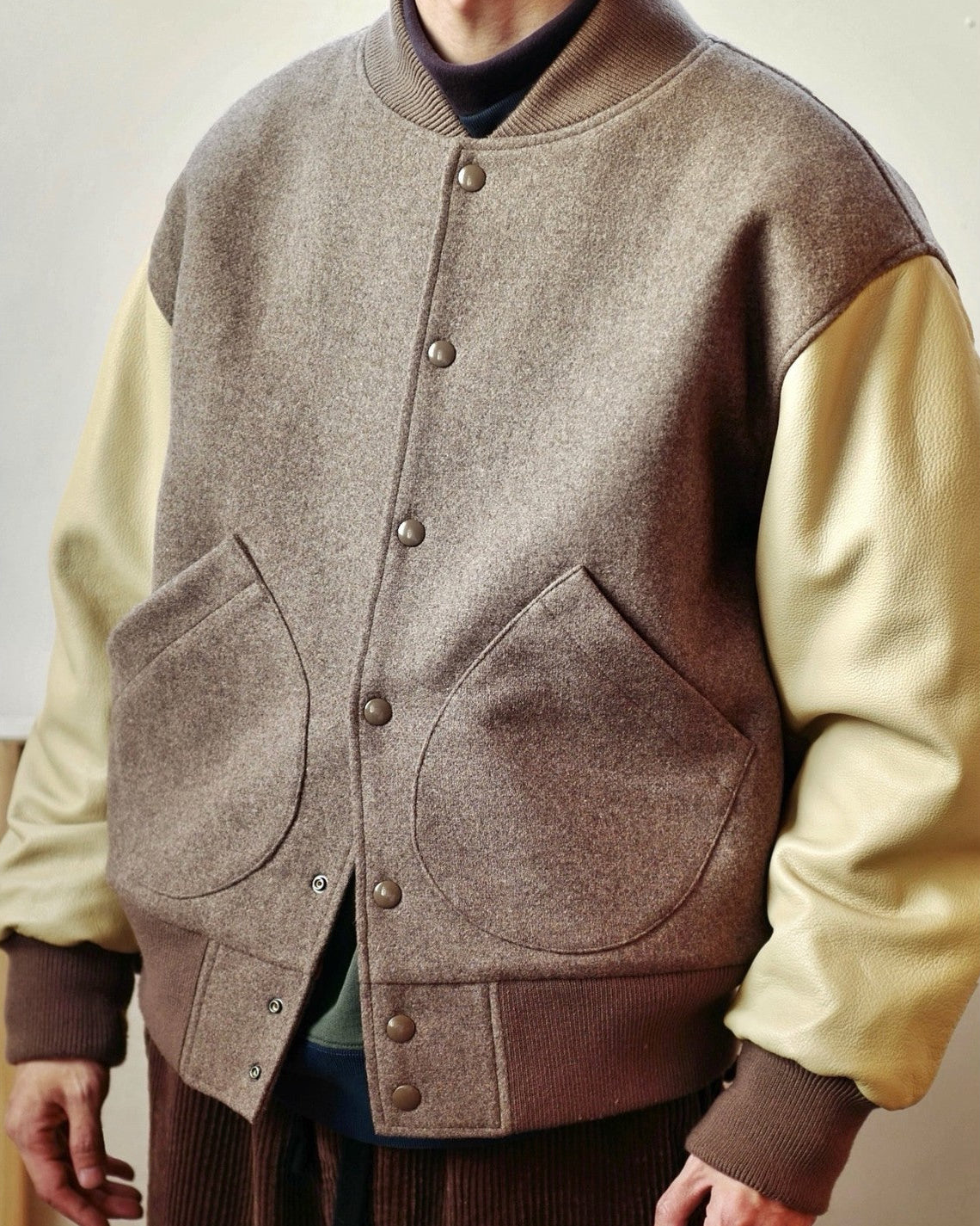 USAGE Reversible Velvet Leather Varsity Jacket in Beige - On Male Model