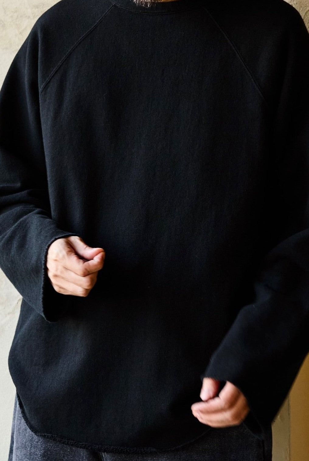 USAGE Slub Cotton Raglan Sweatshirt in Black - On Male Model