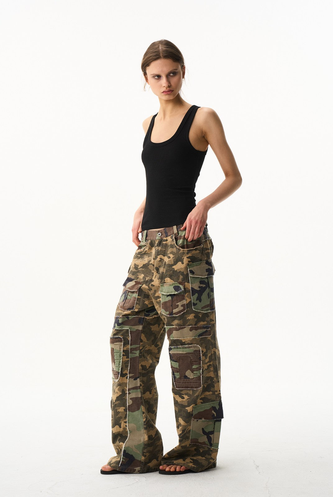 BLINDNOPLAN Paneled Camo Flared Cargo Pants in Green - On Female Model