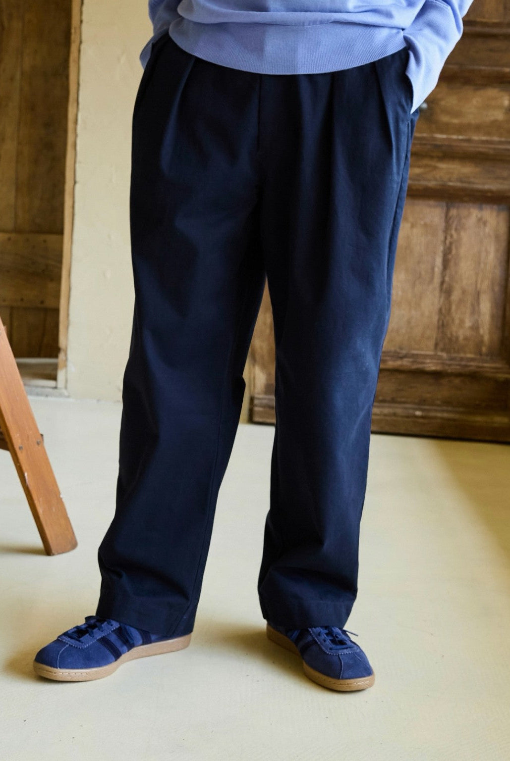 USAGE Pleated Cotton Twill Chinos in Navy Blue - On Model