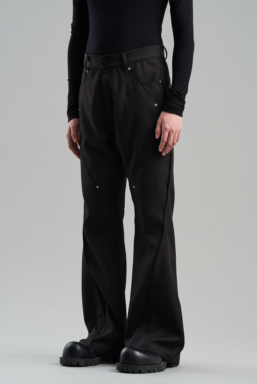 BLINDNOPLAN Diagonal Paneled Trousers with Rivets in Black - On Model