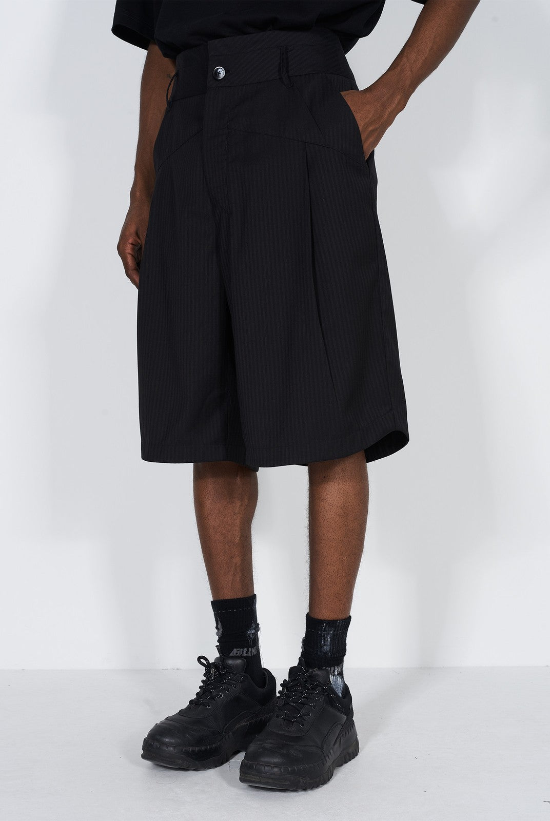 BLINDNOPLAN Asymmetric Striped Suit Shorts in Black - On Male Model