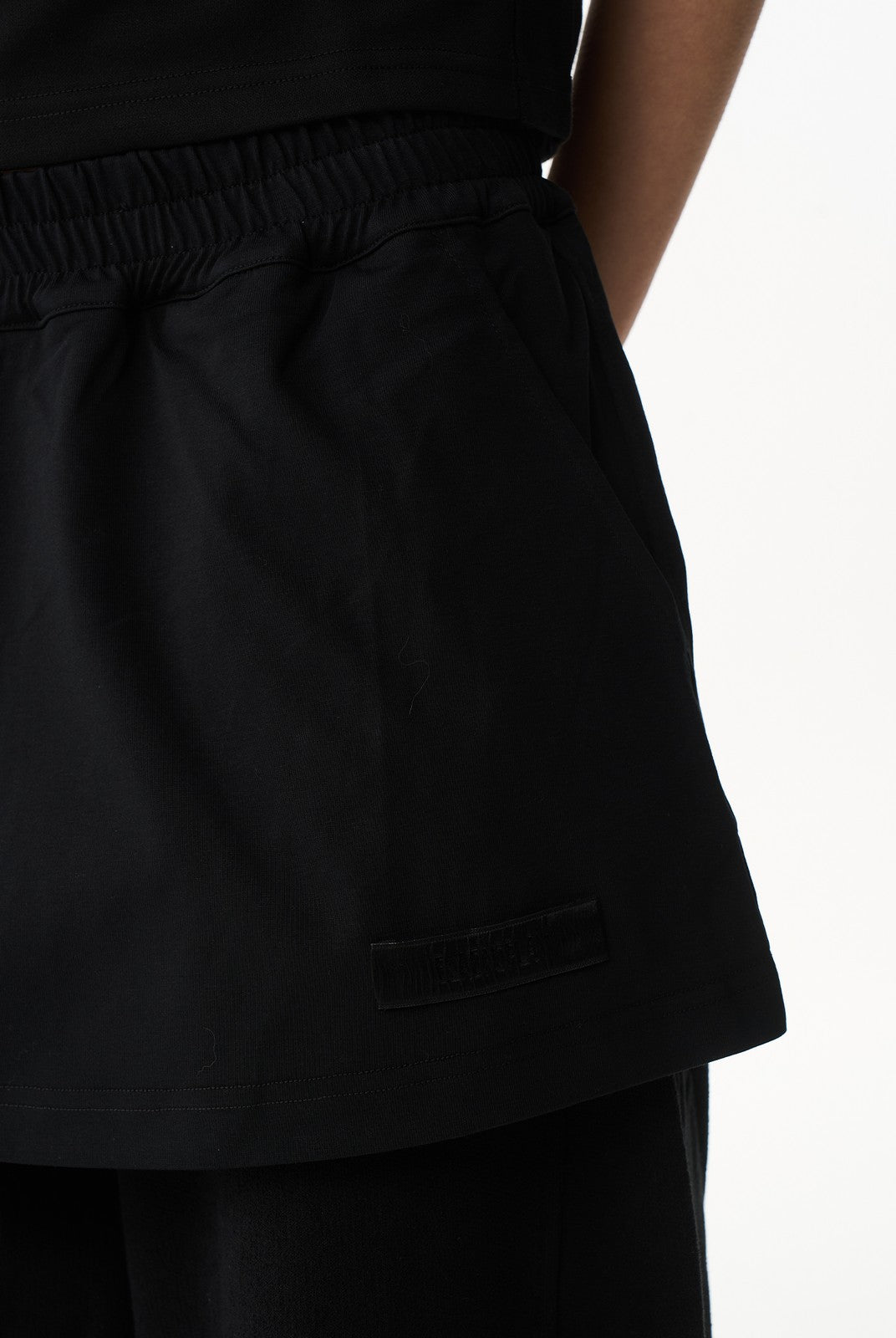 BLINDNOPLAN Layered Cotton Blend Sweatpants in Black - On Model