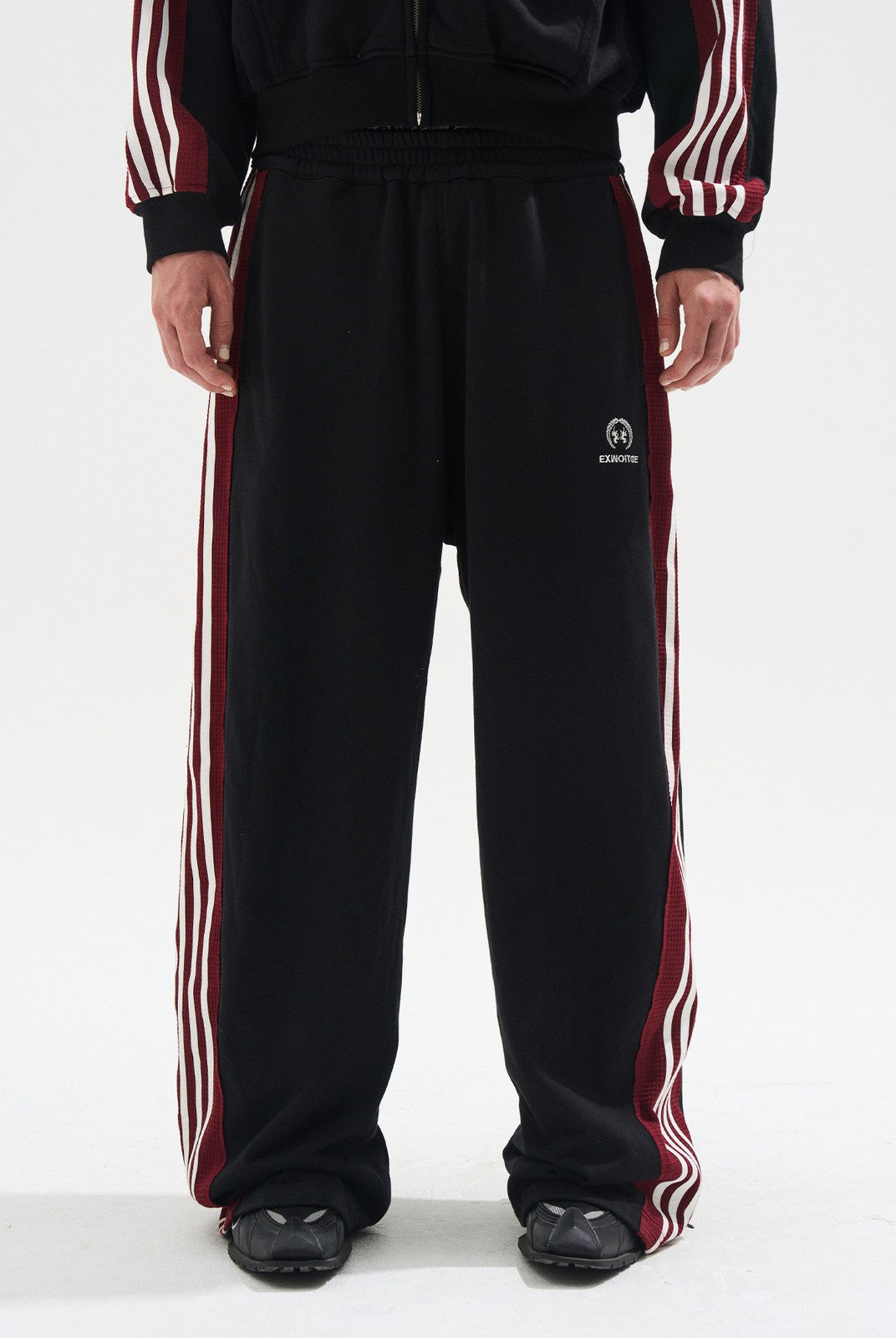 BLINDNOPLAN Raw Edge Contrast Paneled Sweatpants in Black - On Model