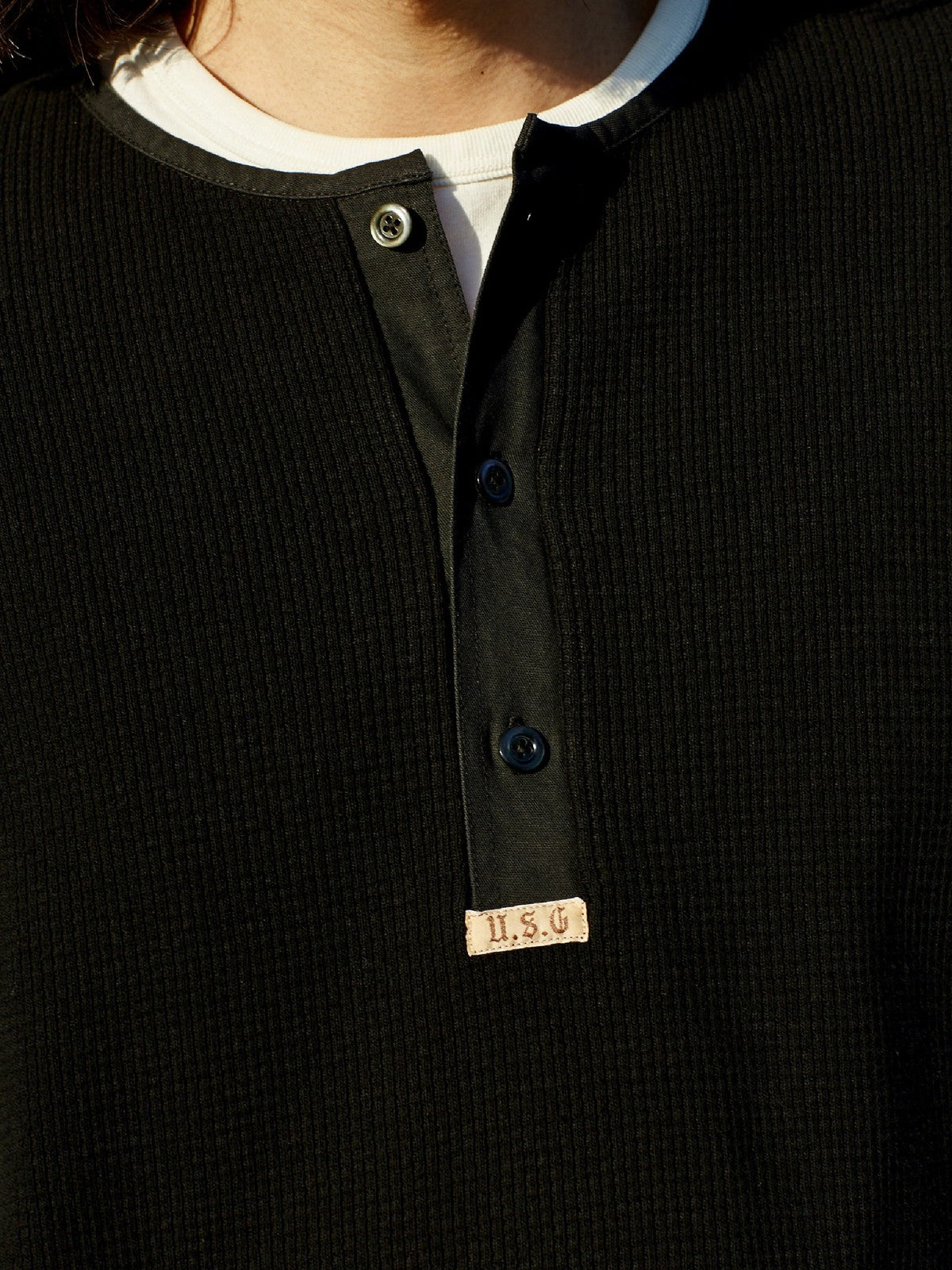 USAGE Heavyweight Waffle Knit Henley Sweatshirt in Black - On Male Model