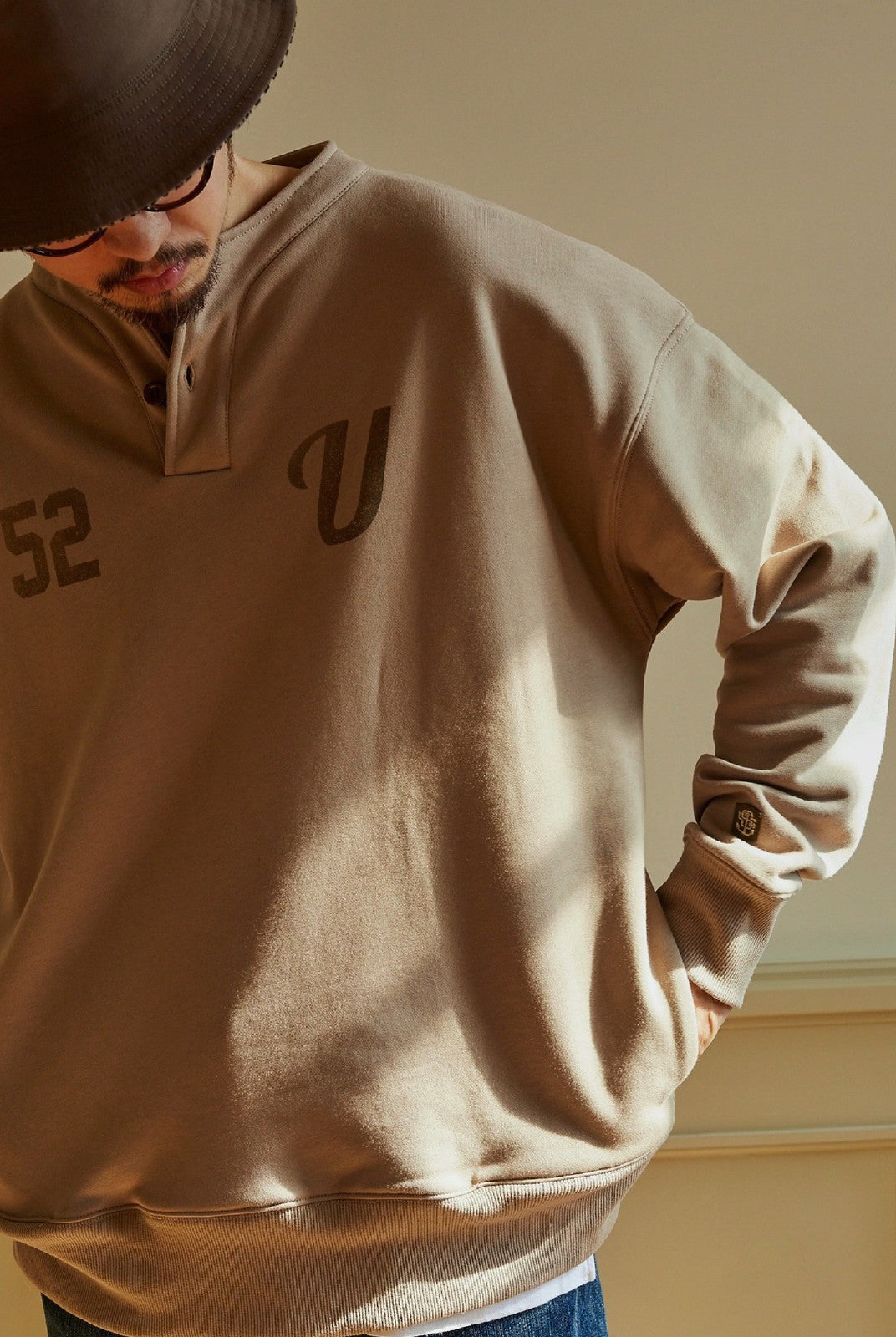 USAGE Terry Cotton Henley Sweatshirt in Beige - On Male Model