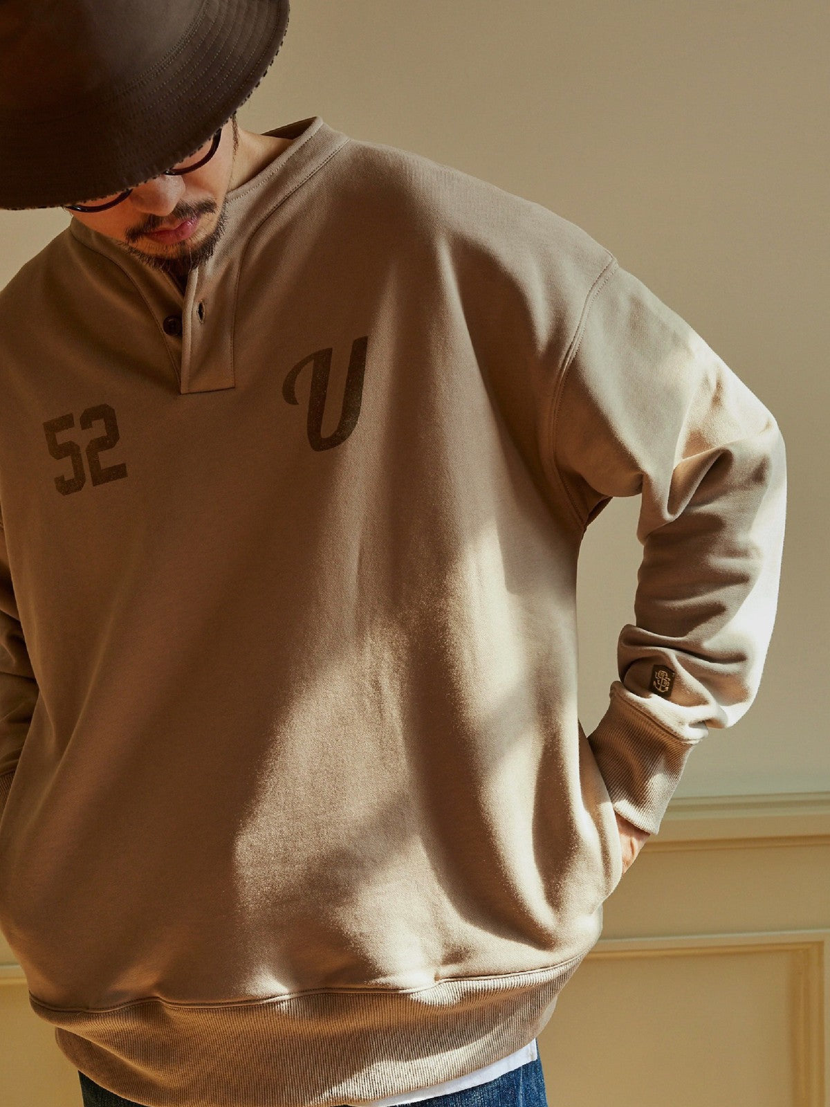 USAGE Terry Cotton Henley Sweatshirt in Beige - On Male Model