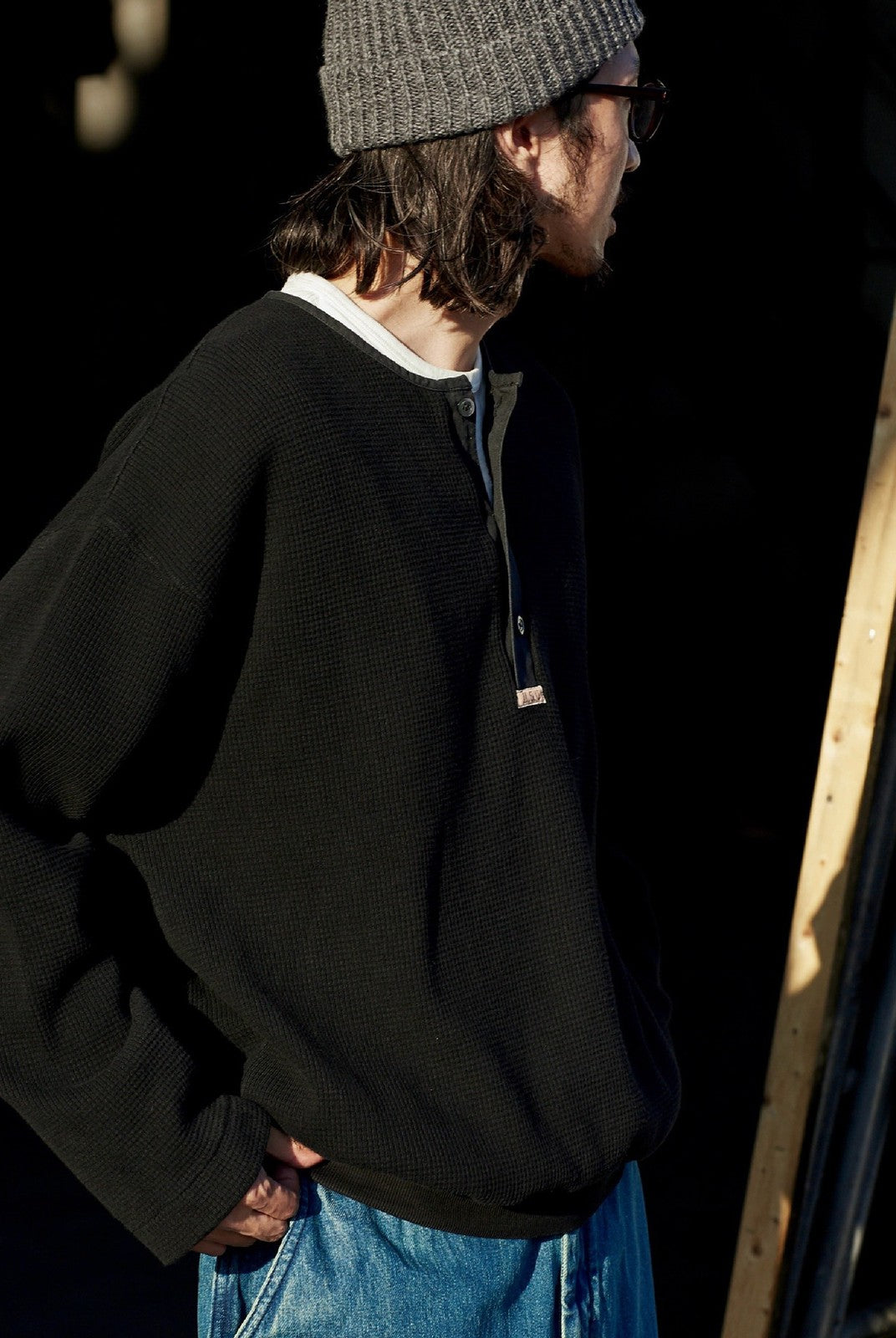 USAGE Heavyweight Waffle Knit Henley Sweatshirt in Black - On Male Model