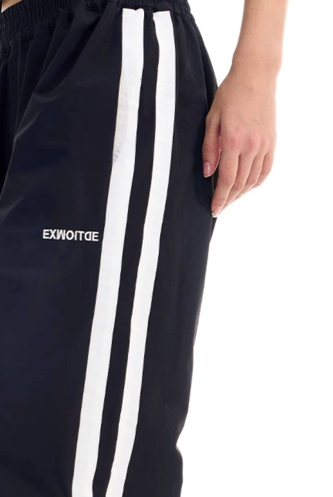 BLINDNOPLAN Striped Pleated Track Pants in Black - On Female Model