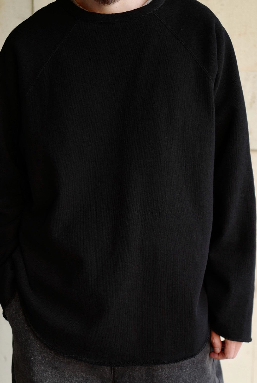 USAGE Slub Cotton Raglan Sweatshirt in Black - On Male Model