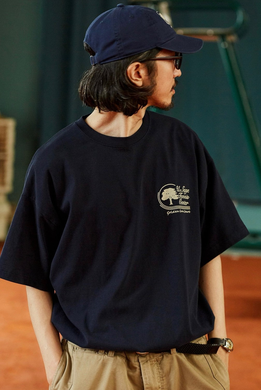 USAGE Retro Tennis Graphic Cotton T Shirt in Navy Blue - On Male Model