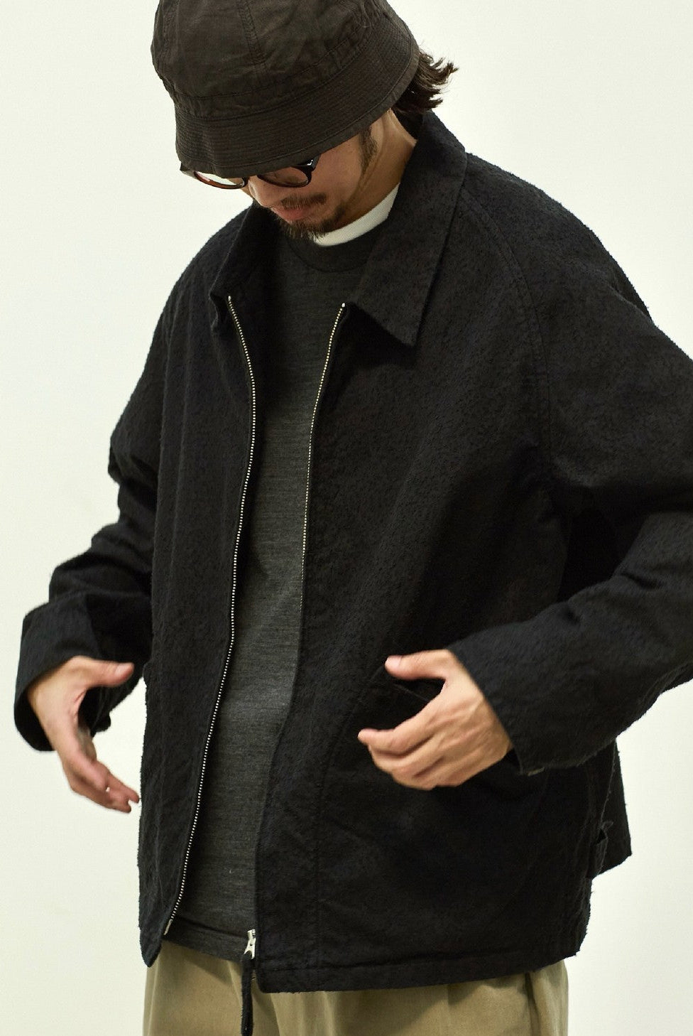 USAGE Textured Nep Blouson Jacket in Black - On Male Model