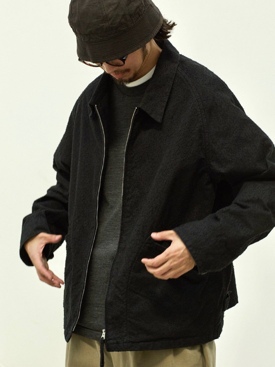 USAGE Textured Nep Blouson Jacket in Black - On Male Model