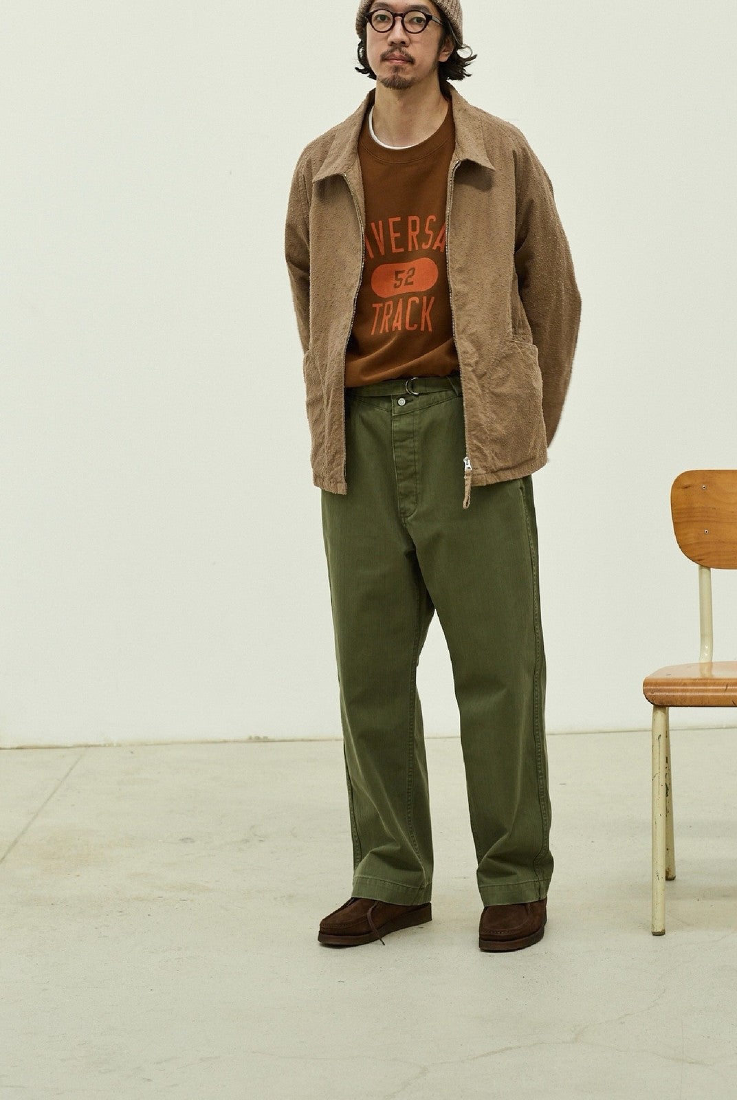 USAGE Heavyweight Herringbone Twill Belted Trousers in Olive - On Male Model