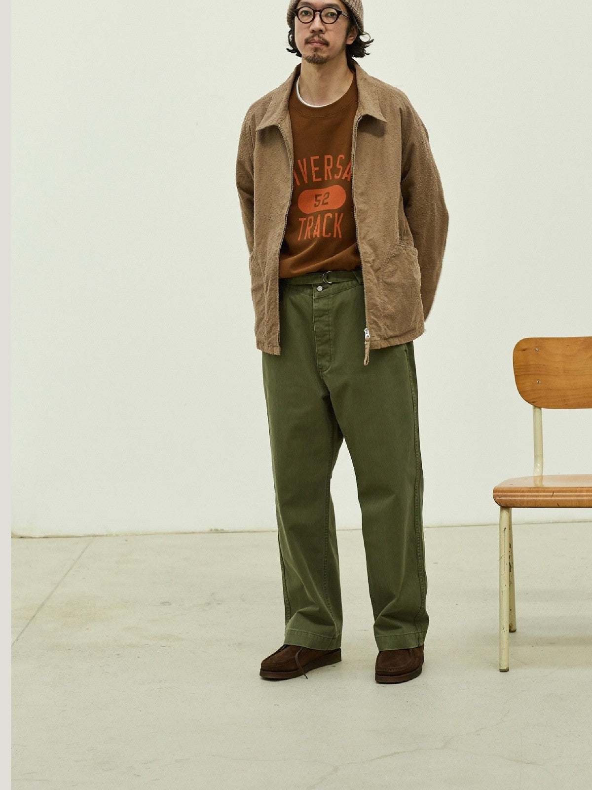 USAGE Heavyweight Herringbone Twill Belted Trousers in Olive - On Male Model