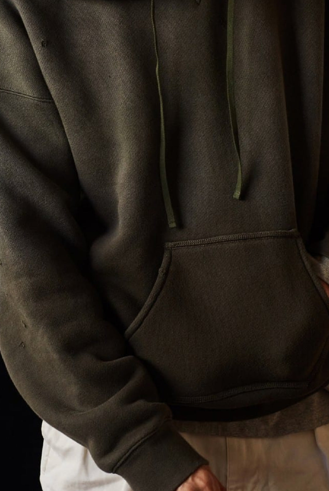USAGE Faded Vintage Wash Hoodie in Olive - On Male Model