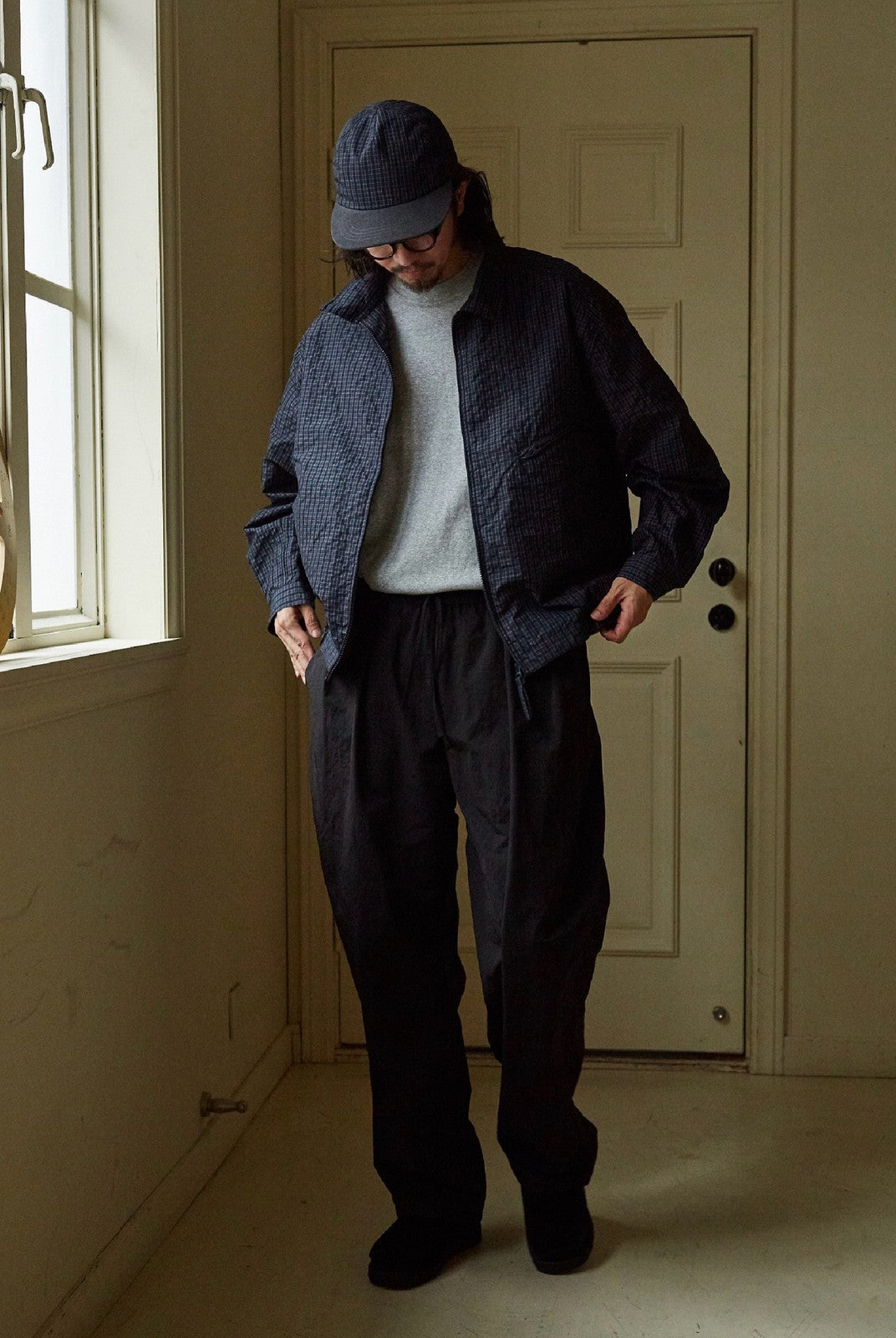 USAGE Jacquard Check Harrington Jacket in Navy Blue - On Male Model