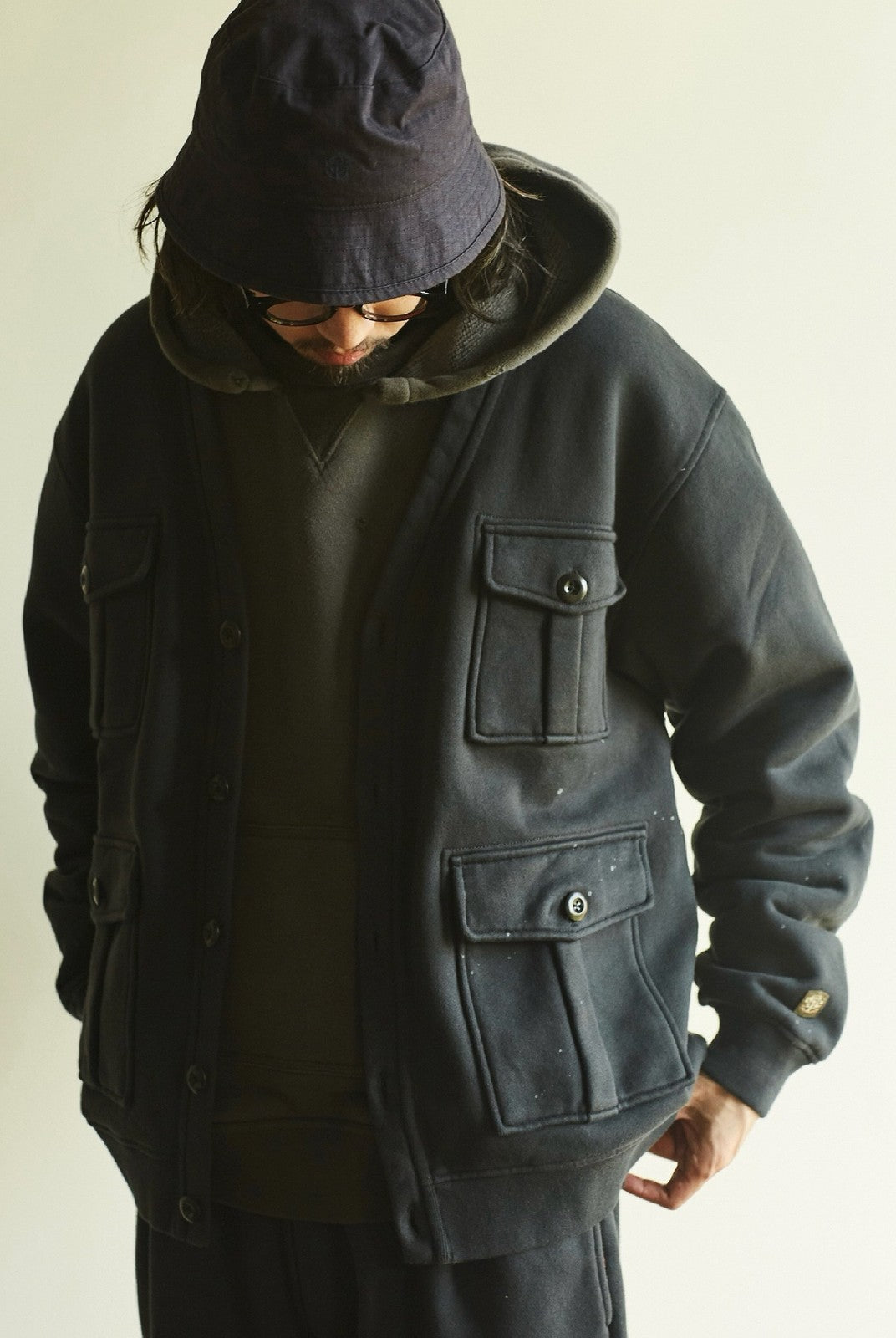 USAGE Cotton Safari Pocket Cardigan Sweatshirt in Navy Blue - On Male Model
