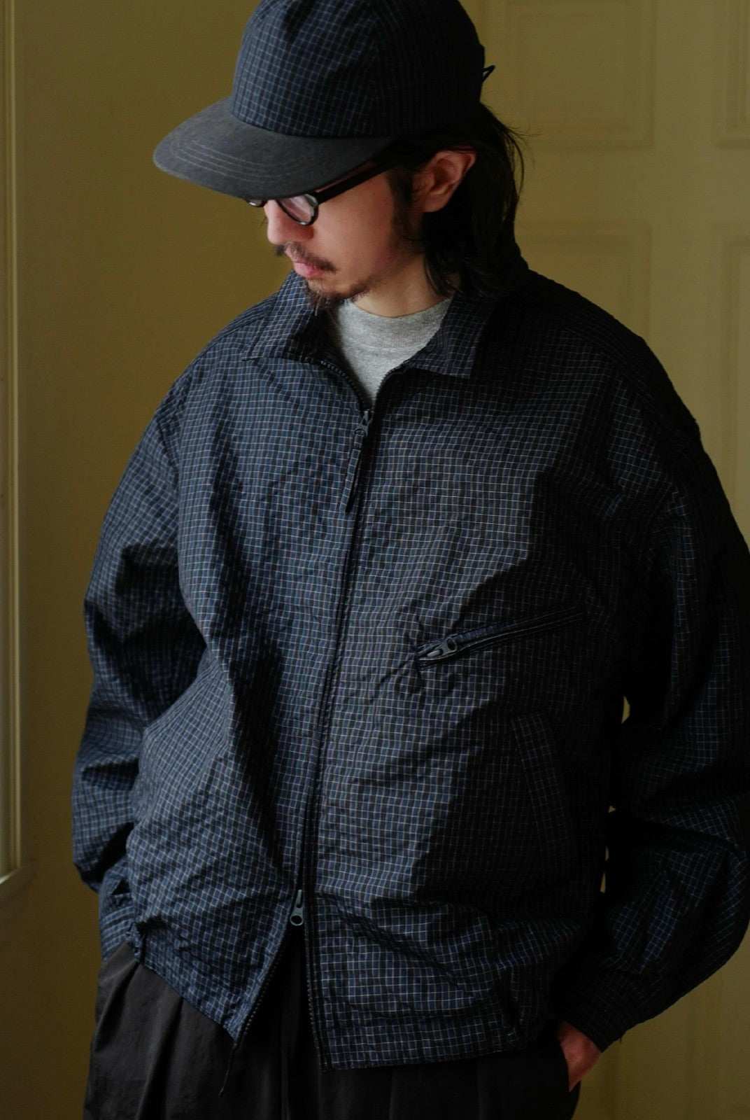 USAGE Jacquard Check Harrington Jacket in Navy Blue - On Male Model