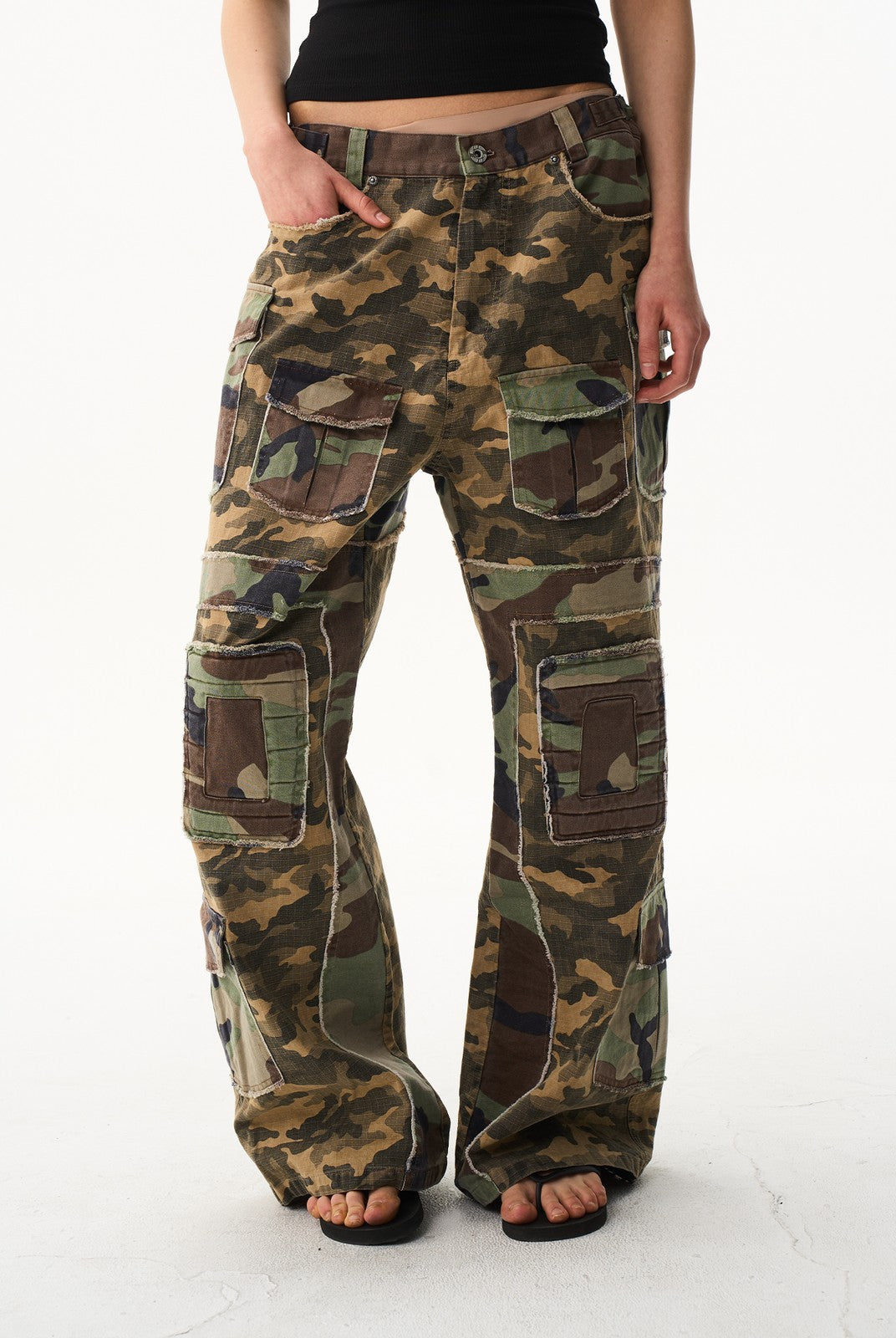 BLINDNOPLAN Paneled Camo Flared Cargo Pants in Green - On Model