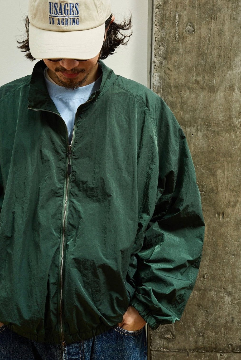 USAGE Lightweight Nylon Zip Up Jacket in Green - On Male Model