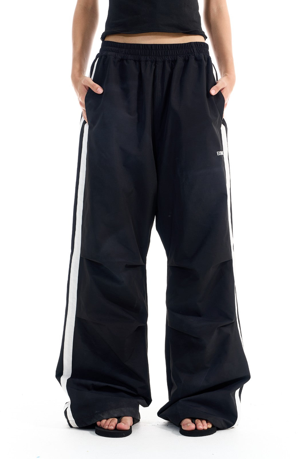 BLINDNOPLAN Striped Pleated Track Pants in Black - On Female Model