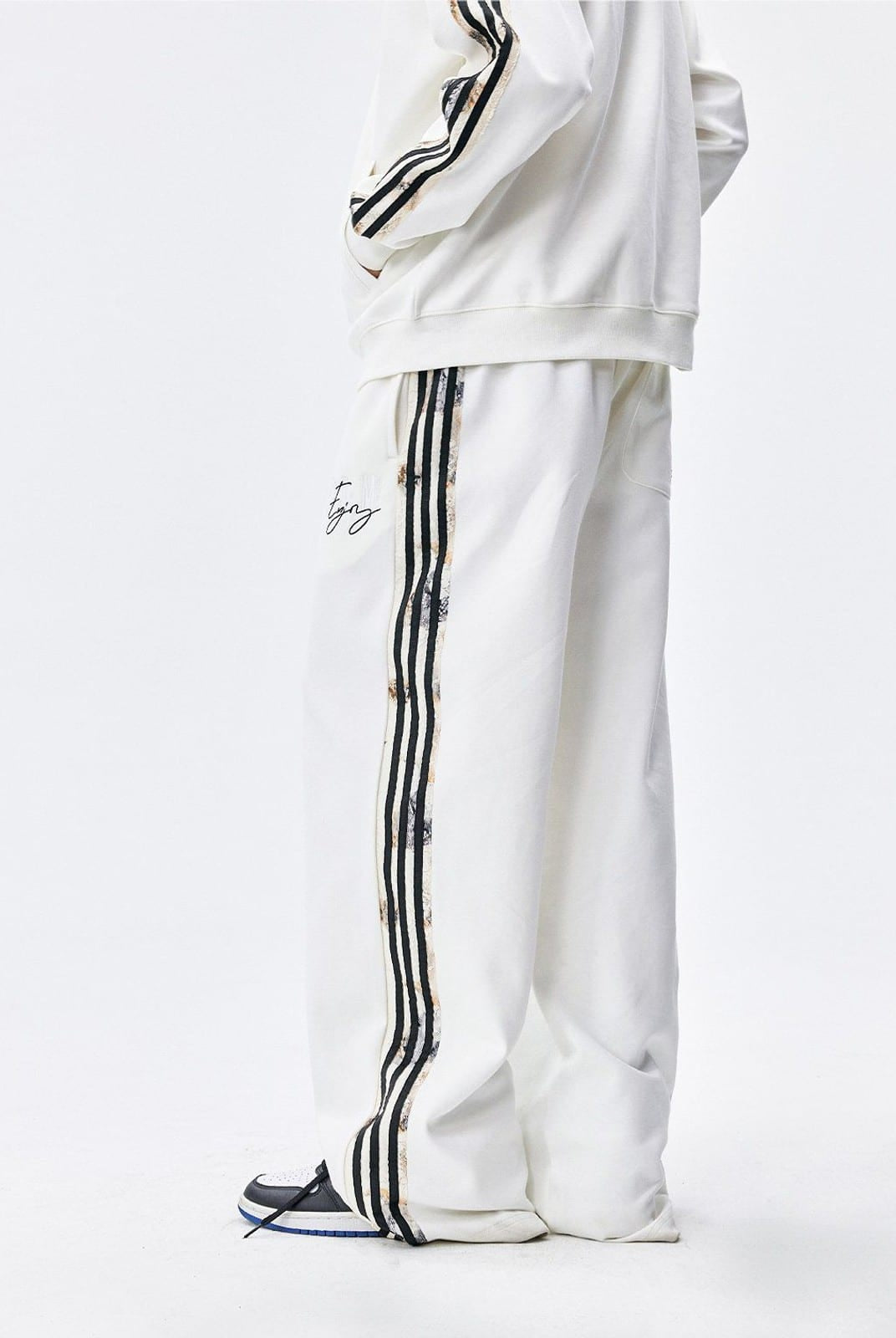 MEDM Lace Paneled Striped Track Pants in White - On Model