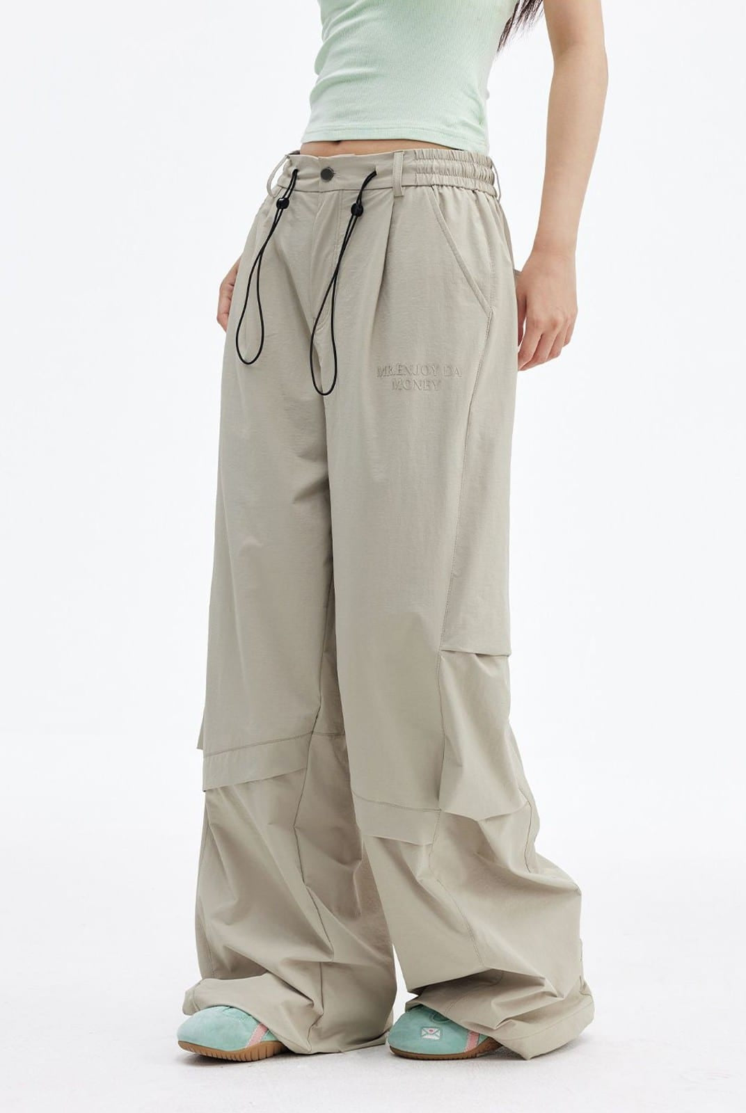 MEDM Crinkled Nylon Parachute Cargo Pants in Beige - On Female Model