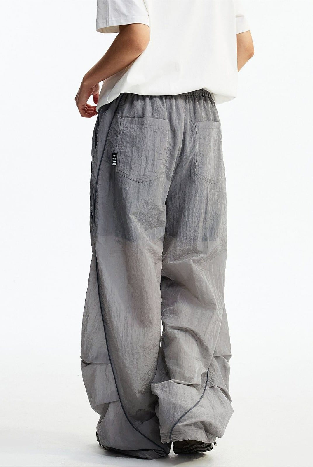 MEDM Glossy Piped Techwear Track Pants in Light Gray - On Model