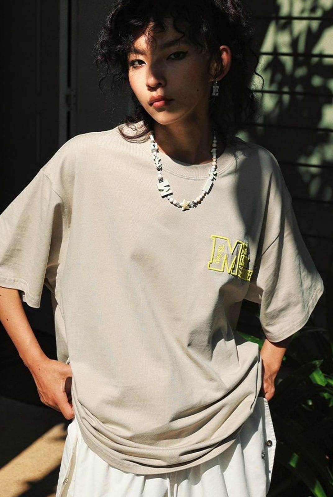 MEDM Half Sleeve Cotton Logo T Shirt in Beige - On Female Model