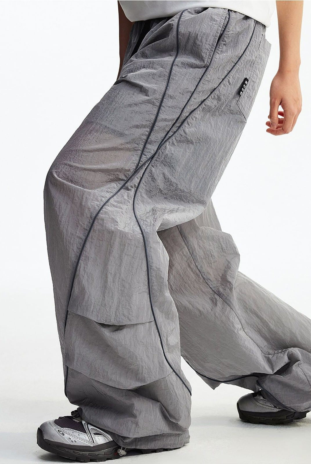 MEDM Glossy Piped Techwear Track Pants in Light Gray - On Model