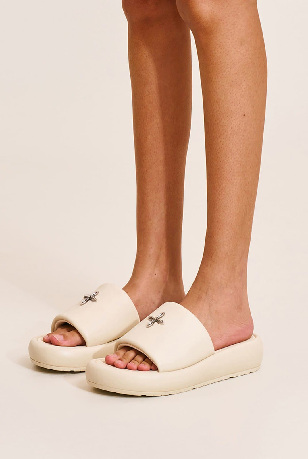 SMFK Cowhide Leather Cross Hardware Slides in Cream - On Model