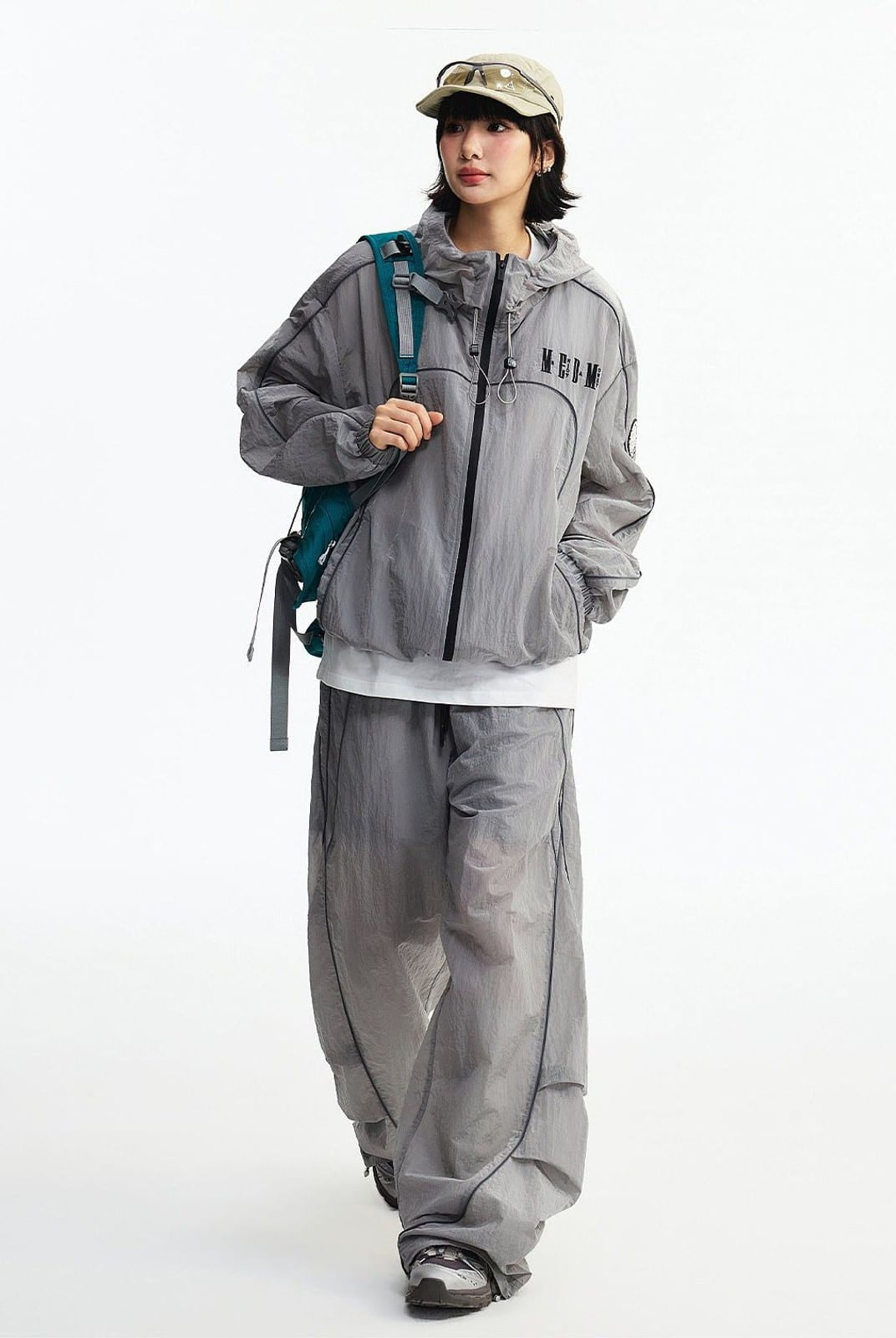 MEDM Glossy Piped Techwear Track Pants in Light Gray - On Female Model