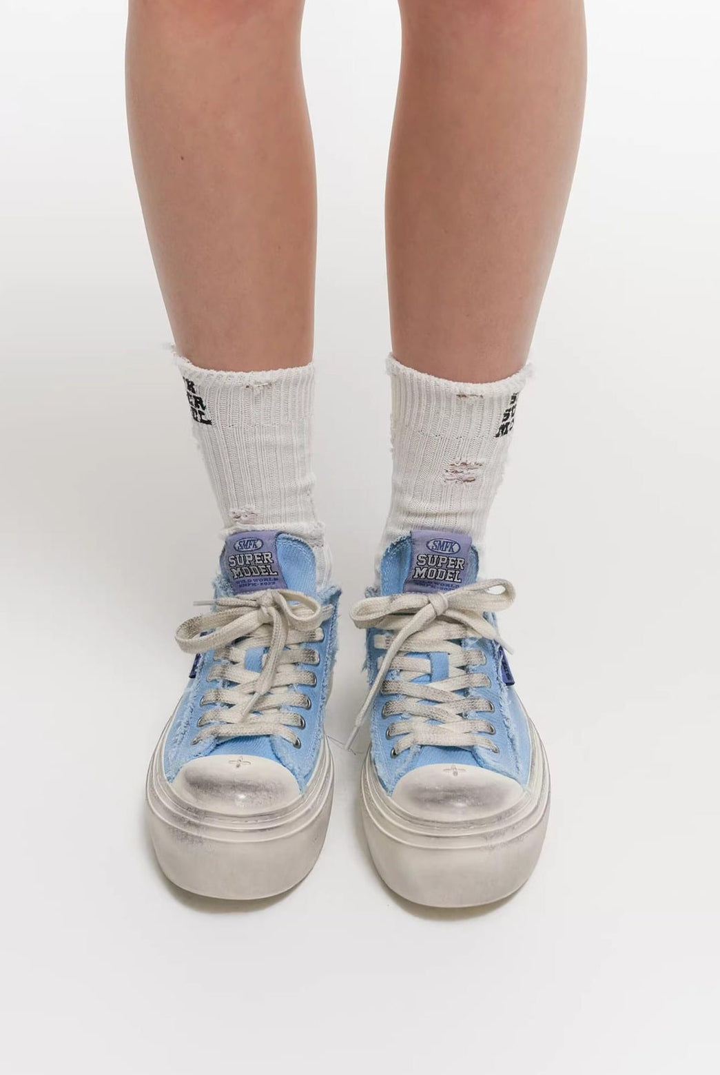SMFK Distressed Canvas Skate Sneakers in Sky Blue - On Model