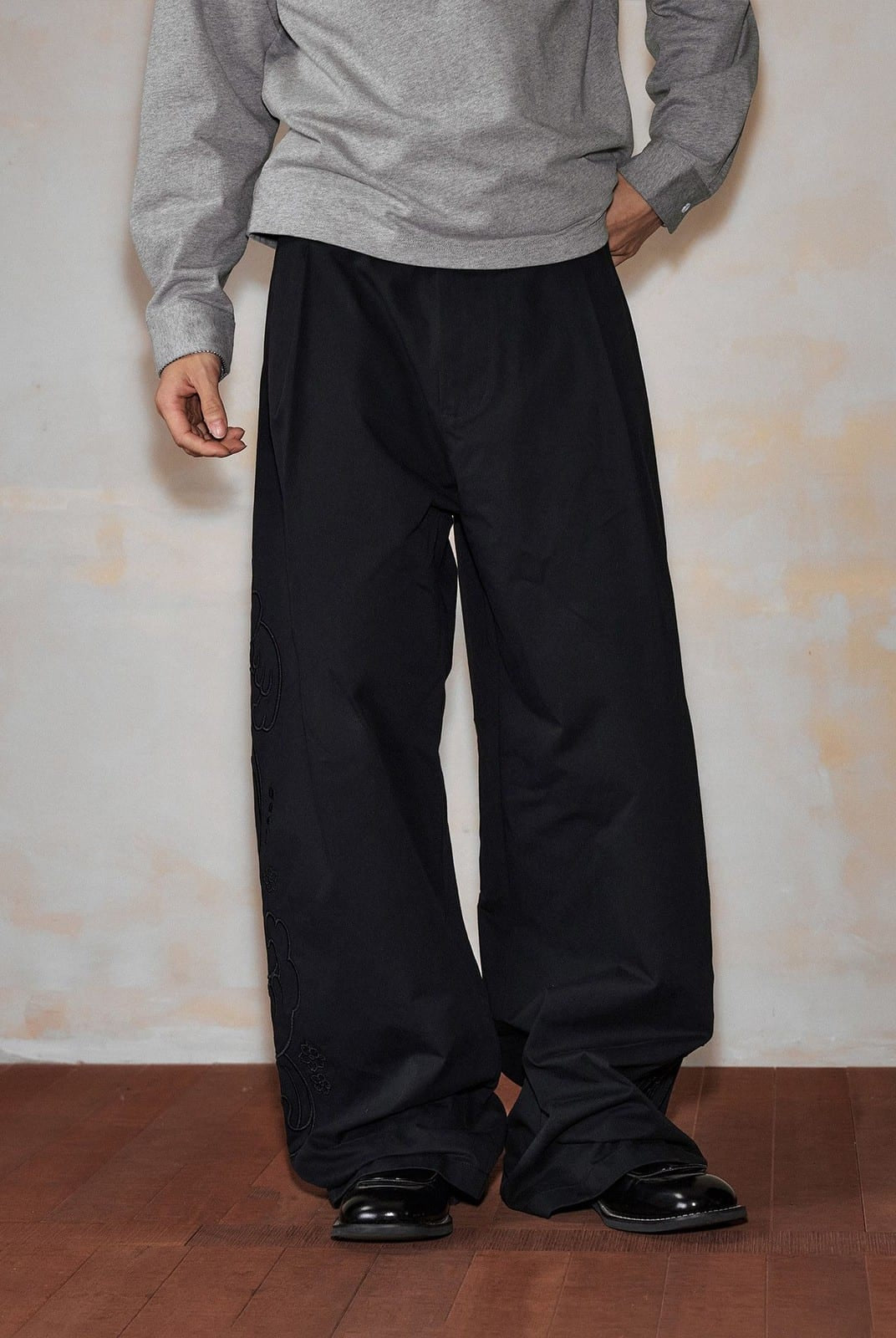 MEDM Embroidered Cotton Cargo Pants in Black - On Model