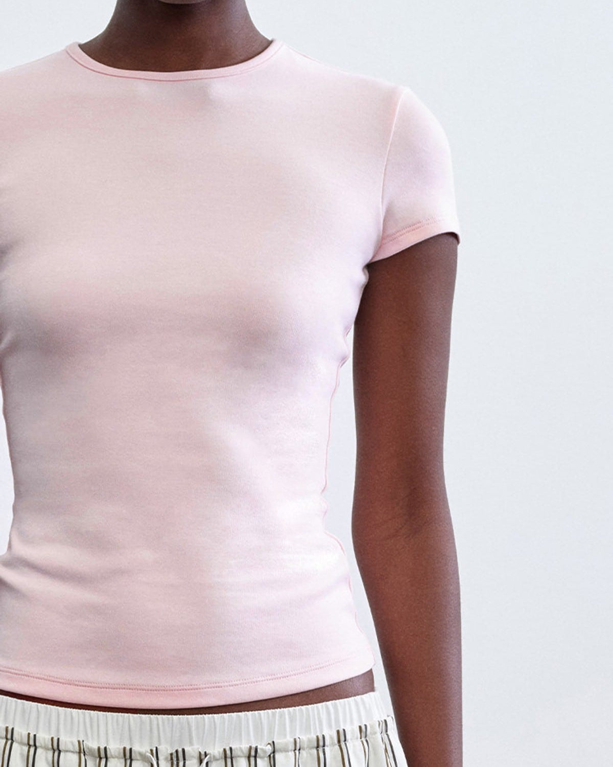 RARELY ALIKE Hourglass Cotton Crew Neck T Shirt in Pink - On Female Model