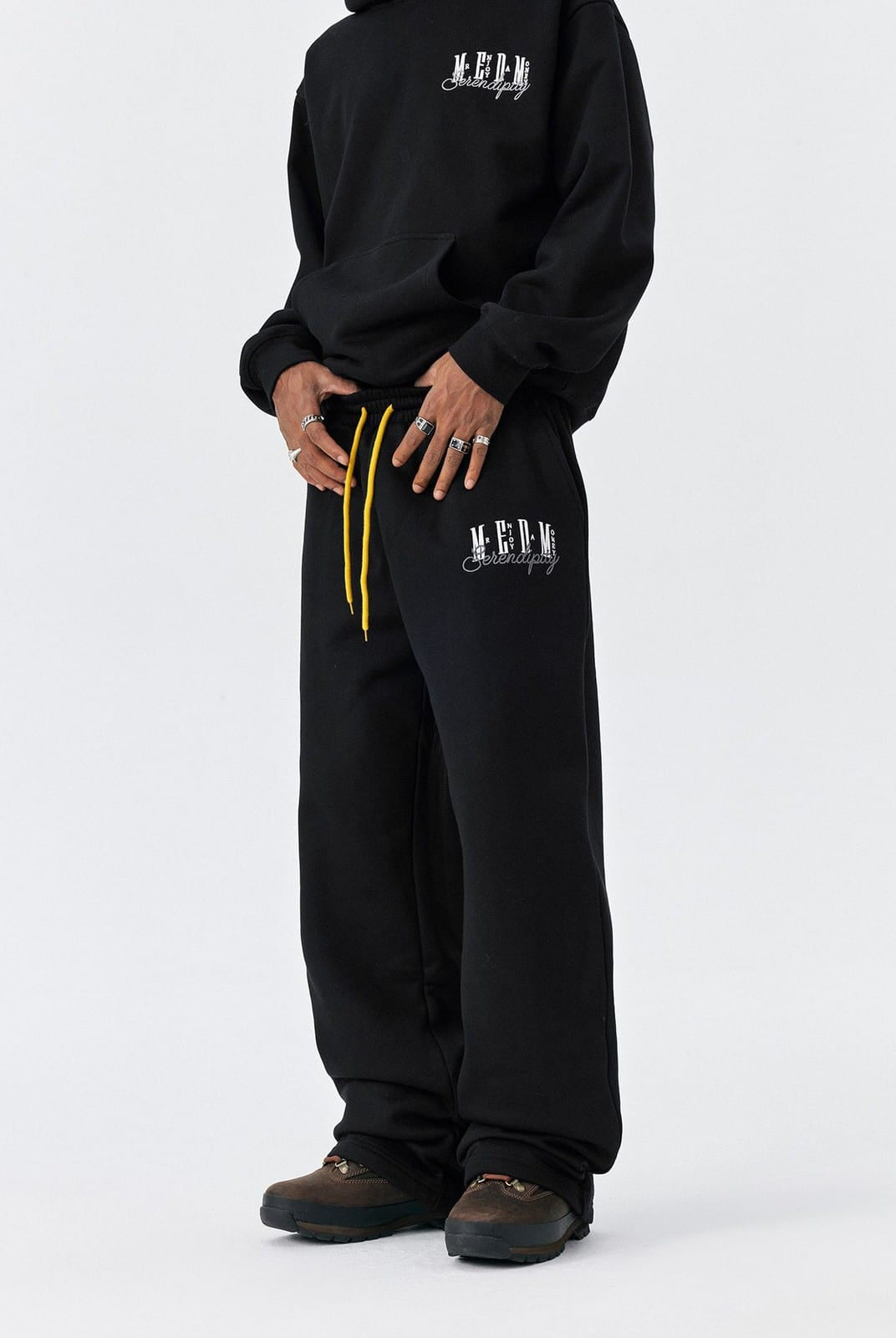 MEDM Fleece Lined Embroidered Sweatpants in Black - On Model
