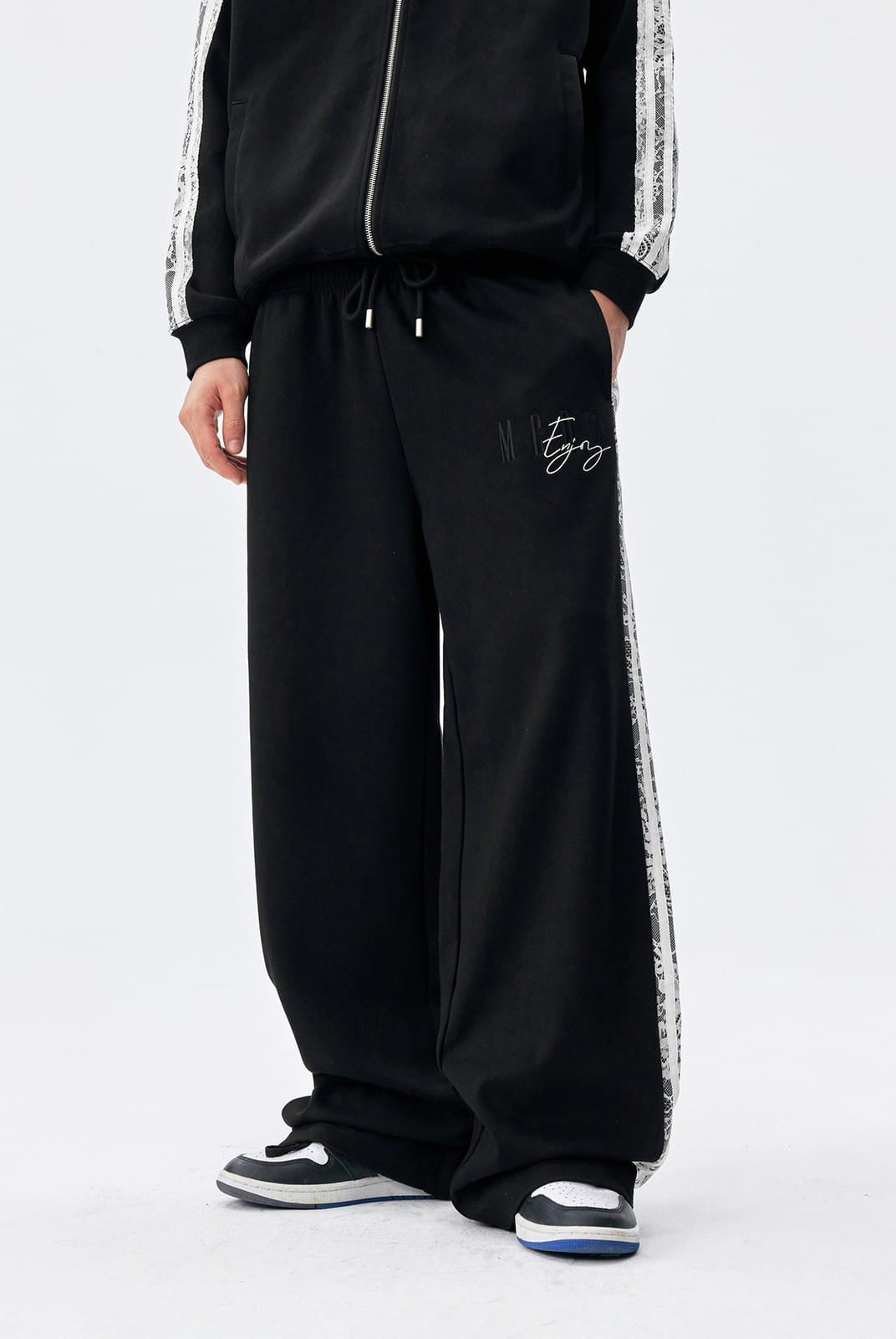 MEDM Lace Paneled Striped Track Pants in Black - On Model