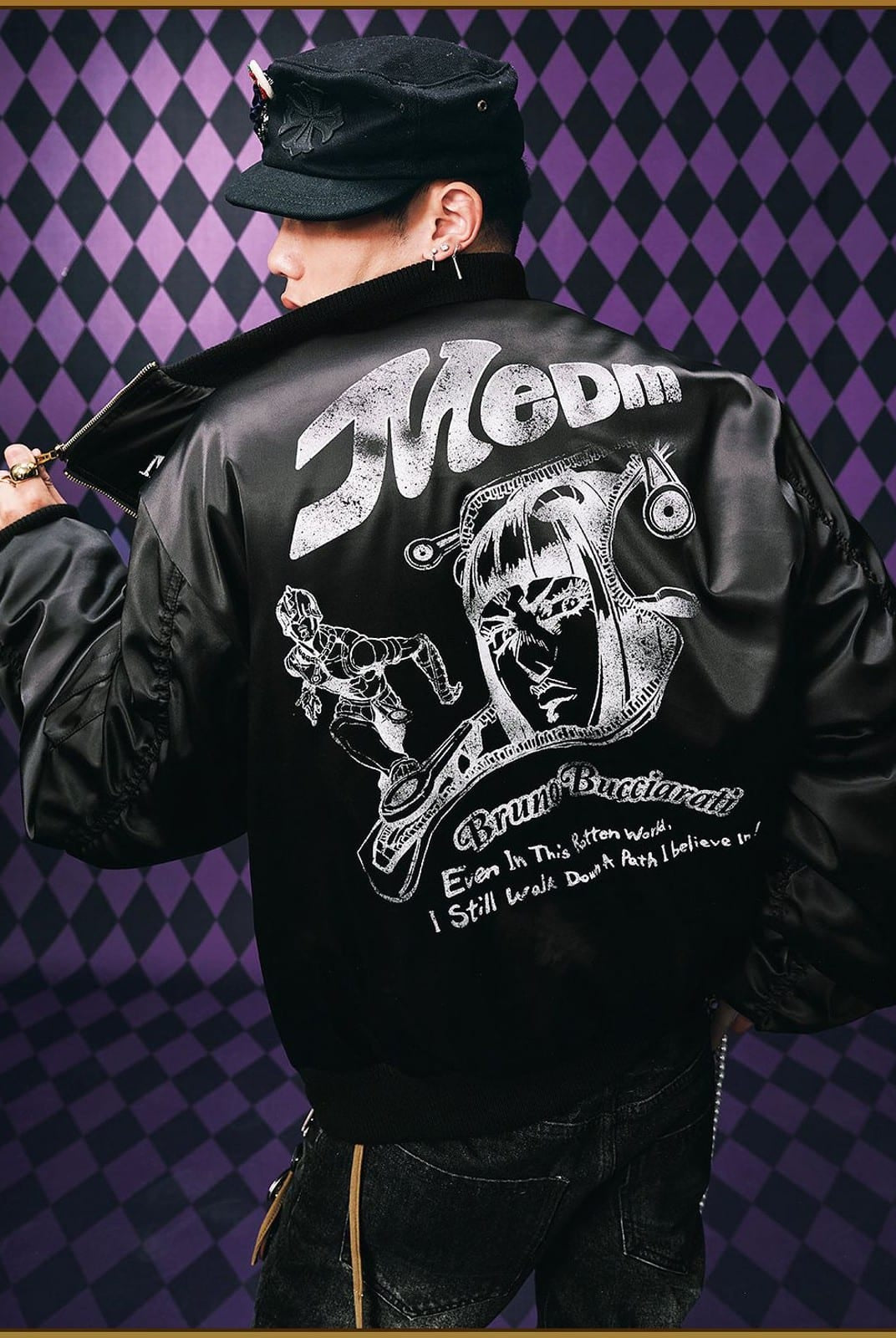 MEDM JoJo Collab Graphic Puffer Bomber in Black - On Male Model
