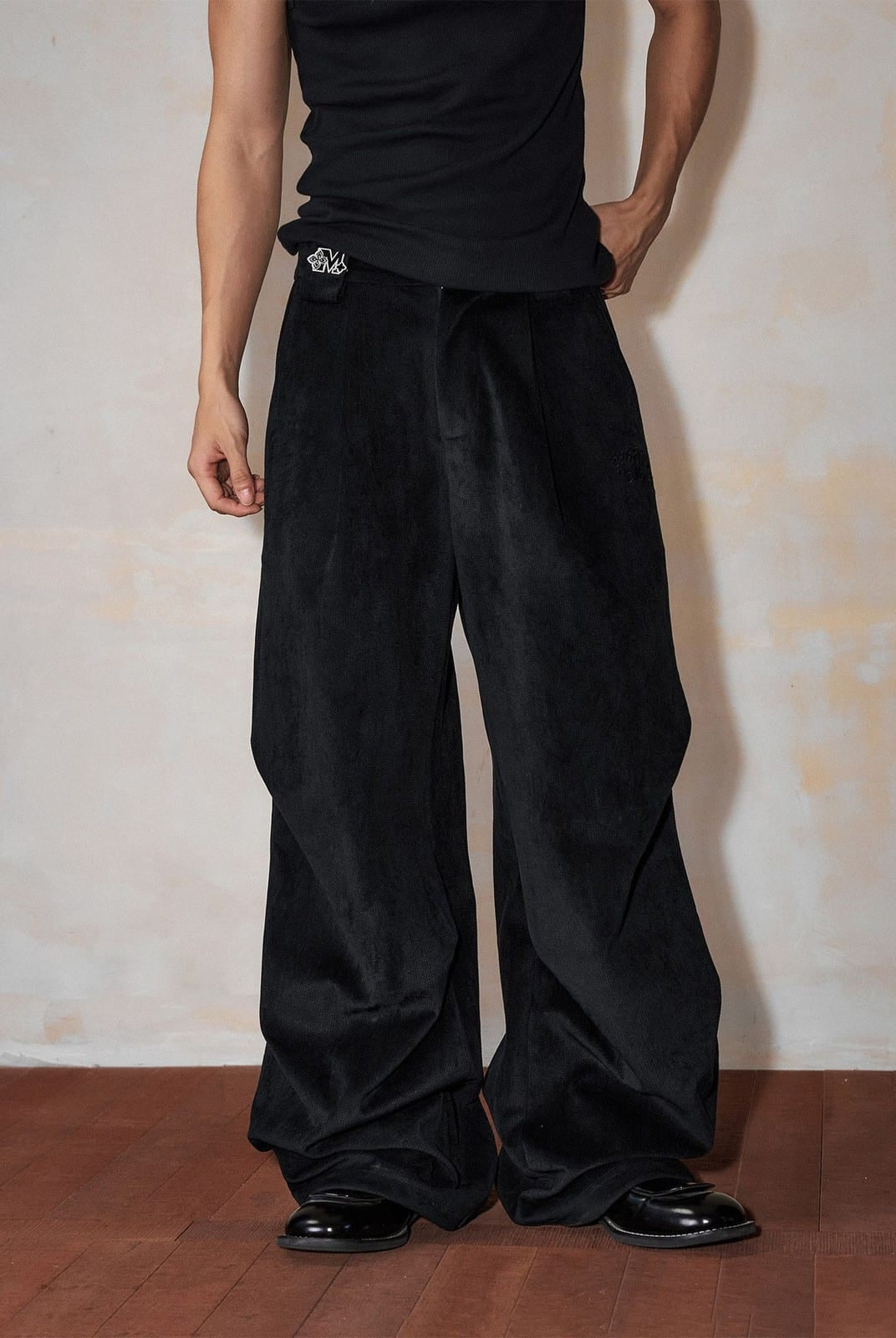 MEDM Wide Leg Parachute Cargo Pants in Black - On Male Model
