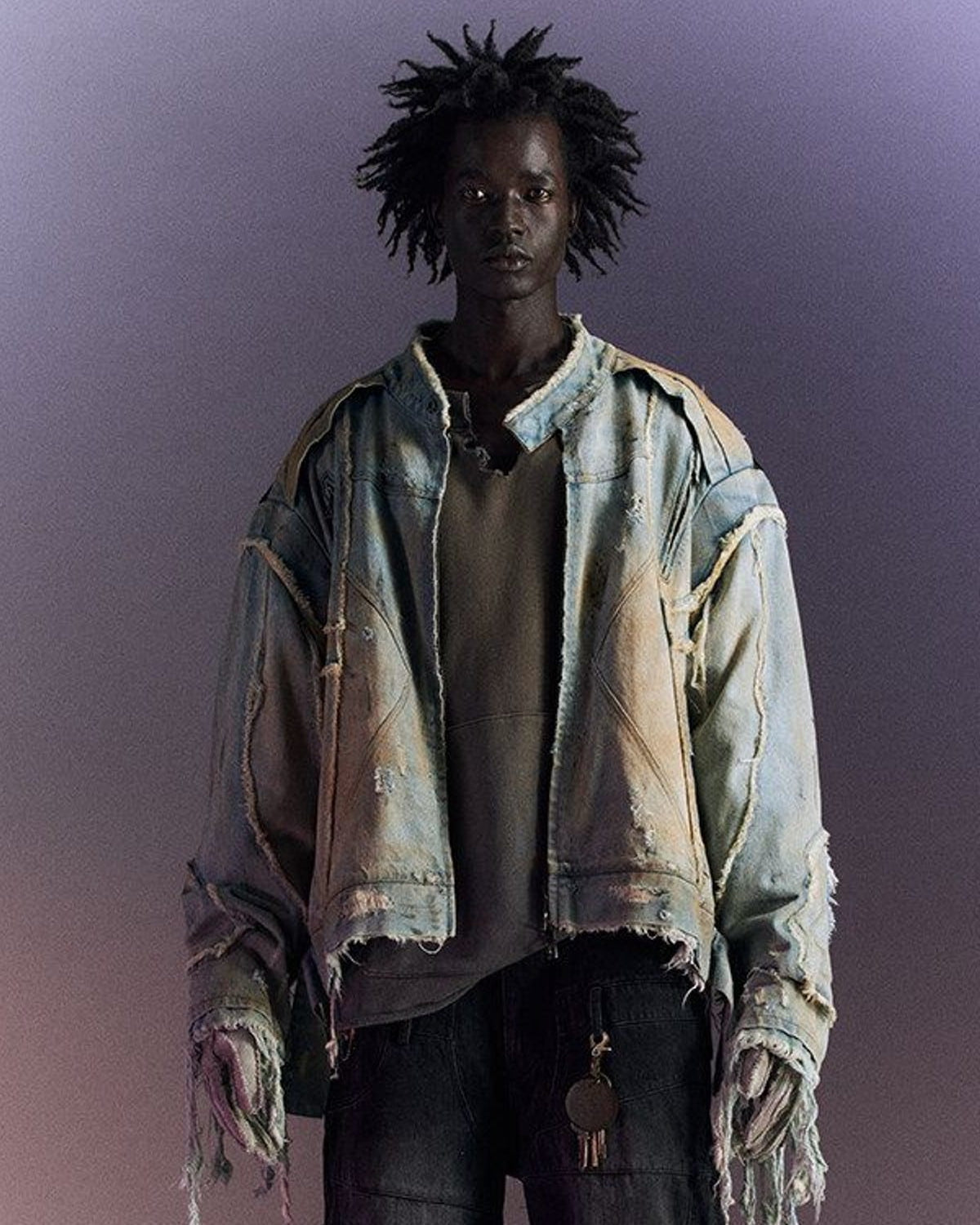 D5ove Mud Dyed Distressed Fringed Denim Jacket in Gray - On Male Model