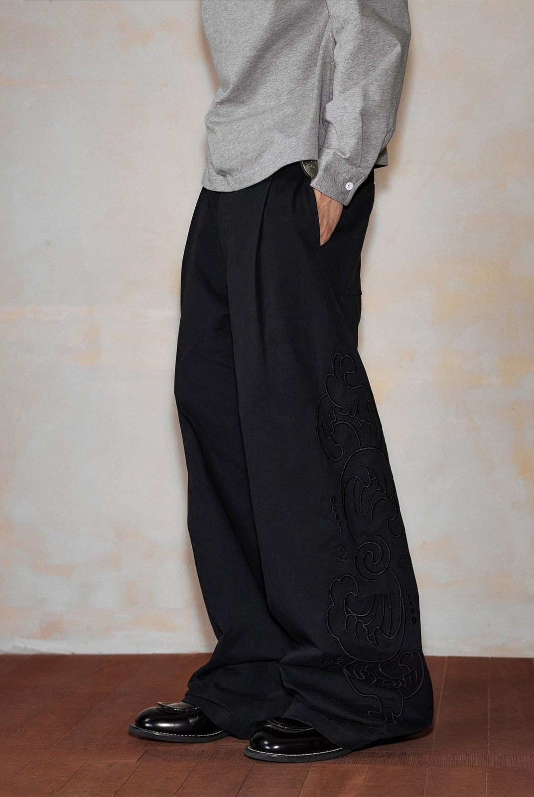 MEDM Embroidered Cotton Cargo Pants in Black - On Model
