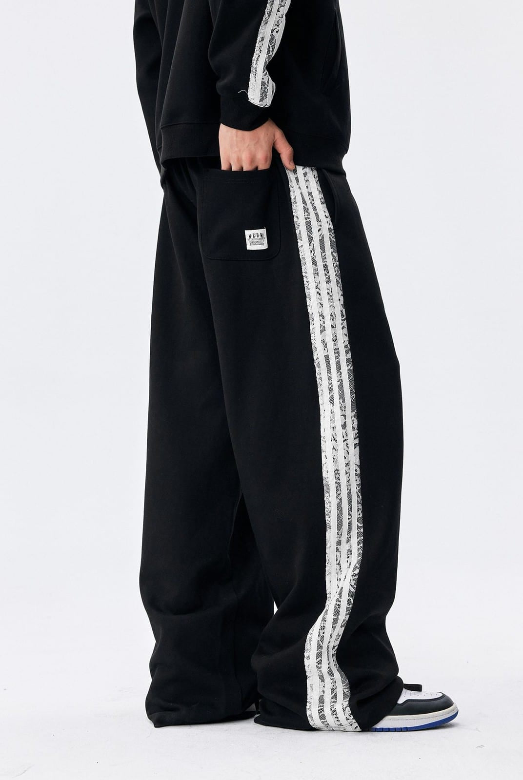 MEDM Lace Paneled Striped Track Pants in Black - On Model