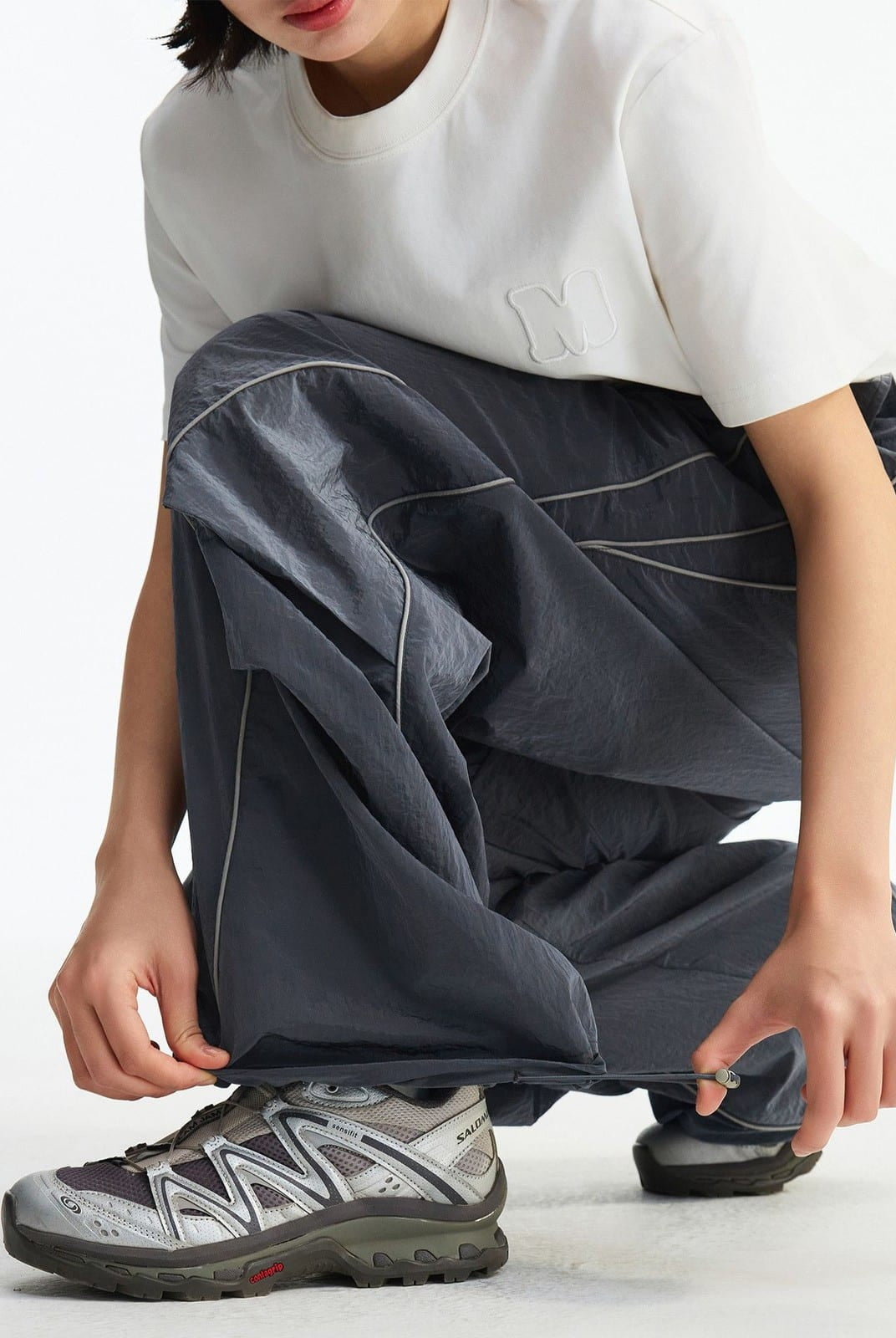 MEDM Glossy Piped Techwear Track Pants in Gray - On Female Model