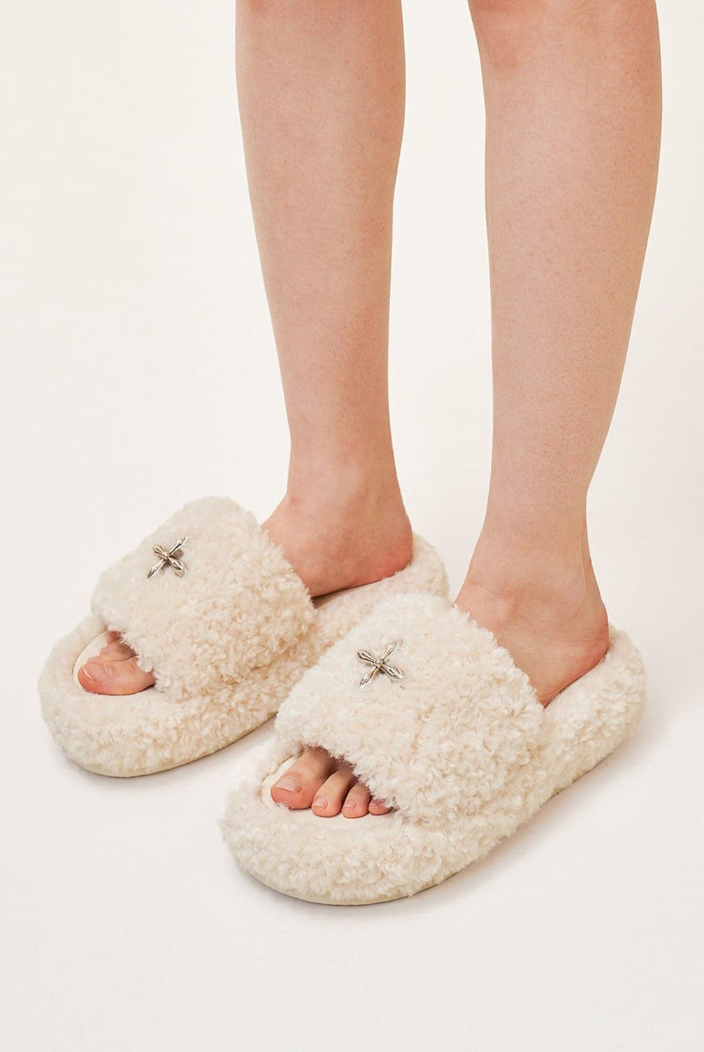 SMFK Cross Motif Faux Fur Platform Slides in White - On Model
