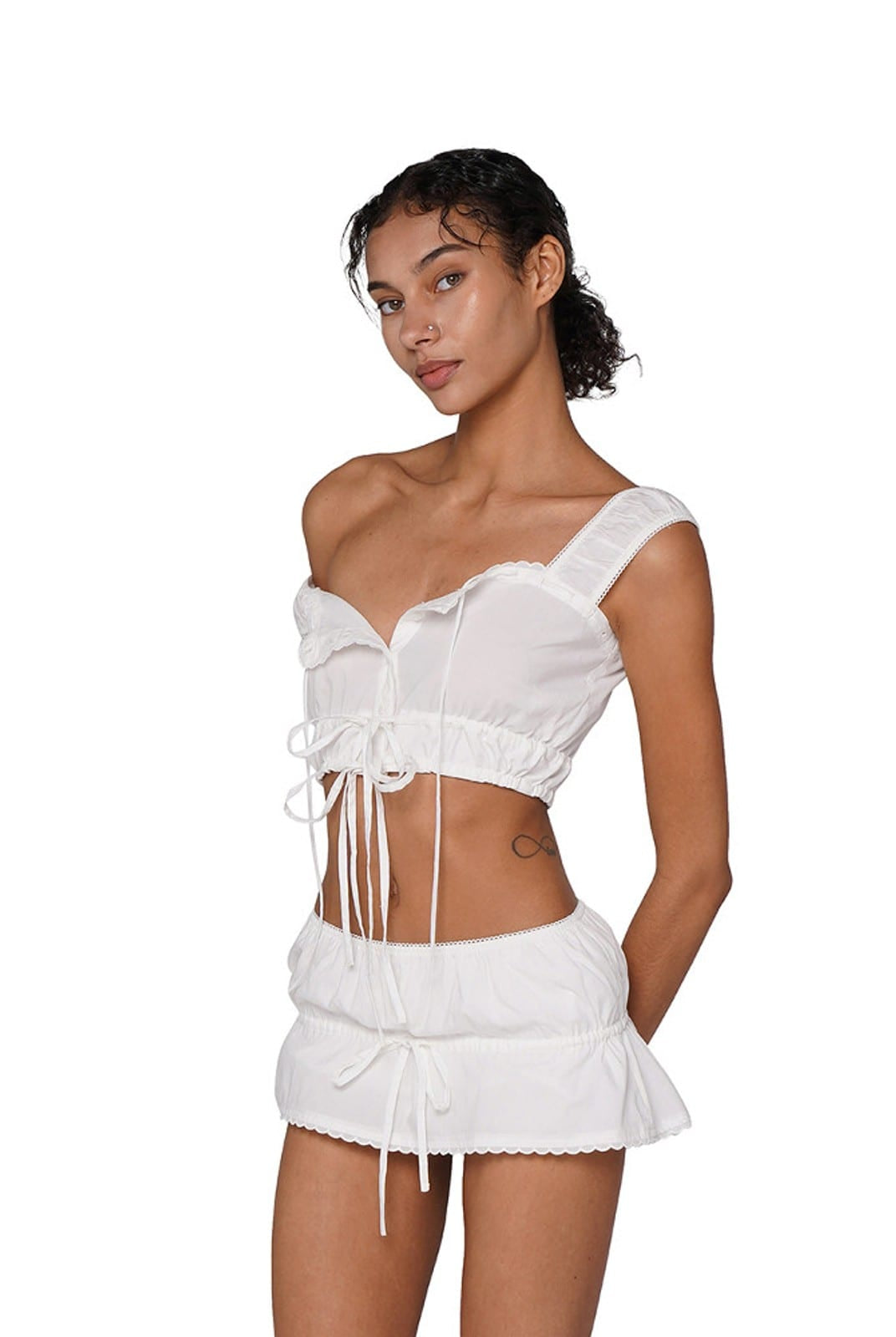 SweetChilling Tie Front Ruffled Mini Skirt in White - On Female Model